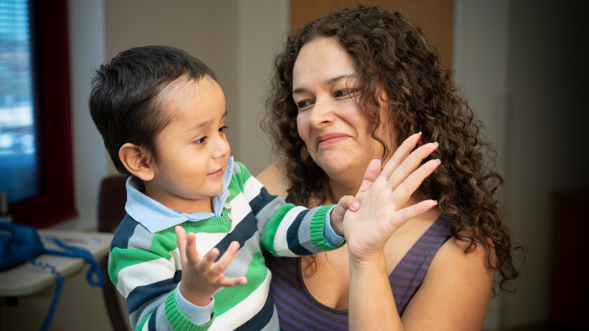 Photo of 2-year-old boy, Gael, who is playing with his Mom after receiving therapy for SCID