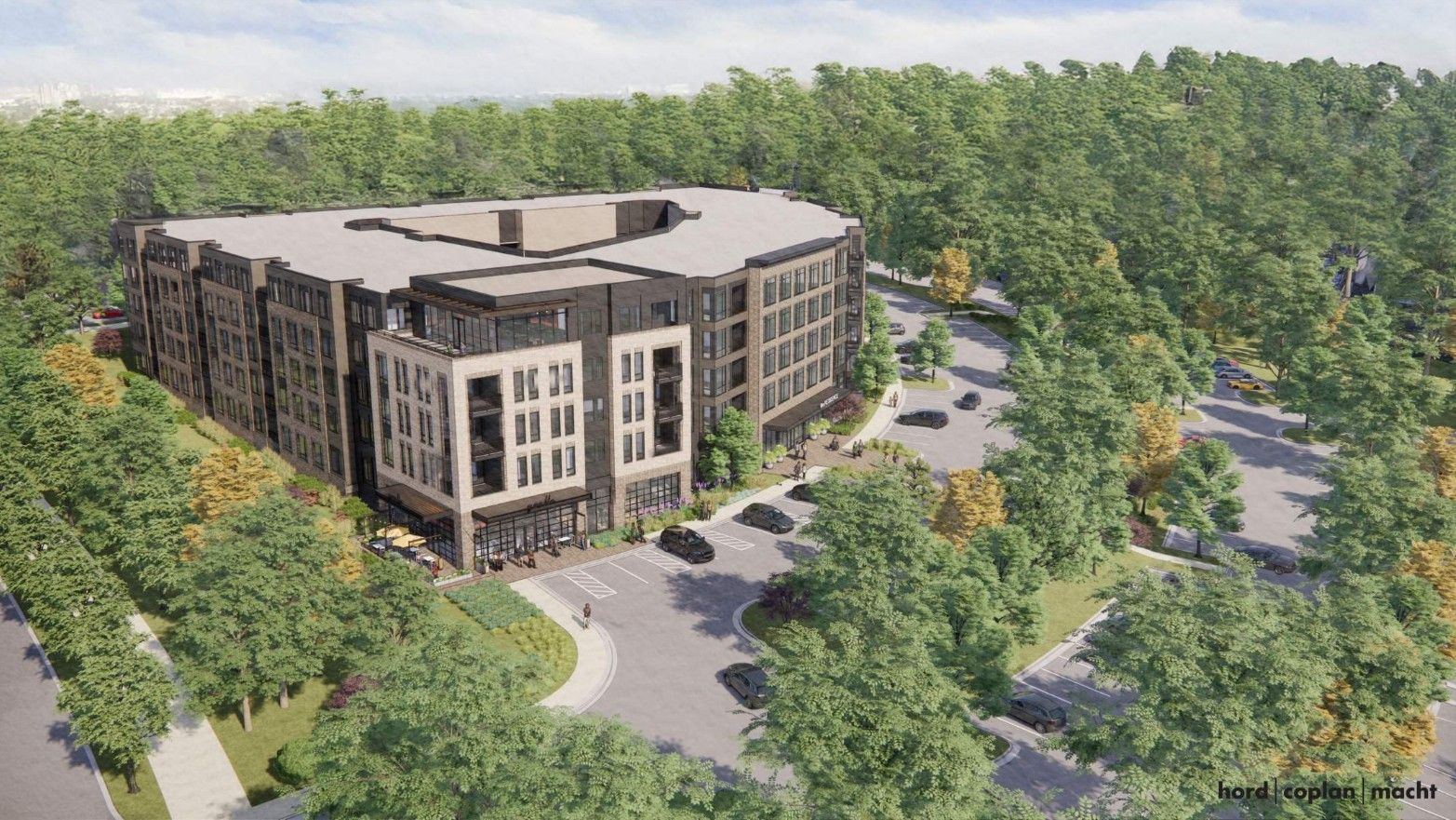 Aerial rendering of a modern, L-shaped, multi-story office building in beige and dark stone, with large windows, set among dense, tree-covered surroundings; a parking lot and sidewalks are in front.