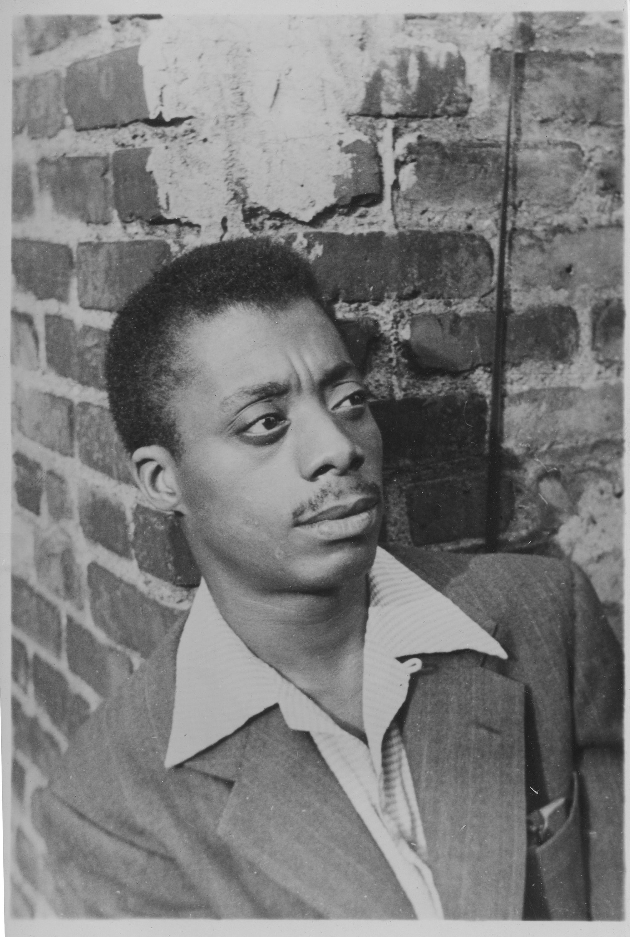 Baldwin as he poses on a rooftop on West 54th Street New York City, 1953