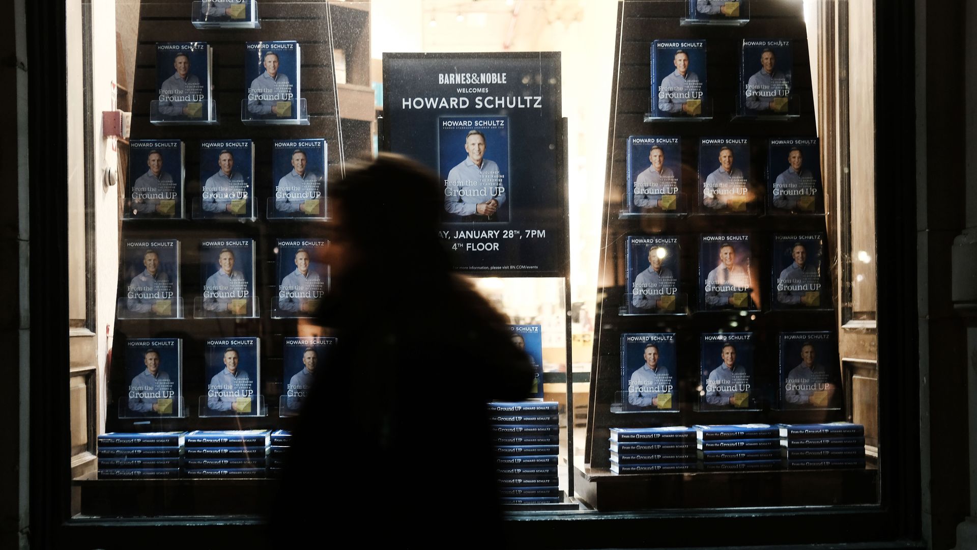 A photo of the new book by Howard Schultz featured in a window at a Barnes and Noble bookstore