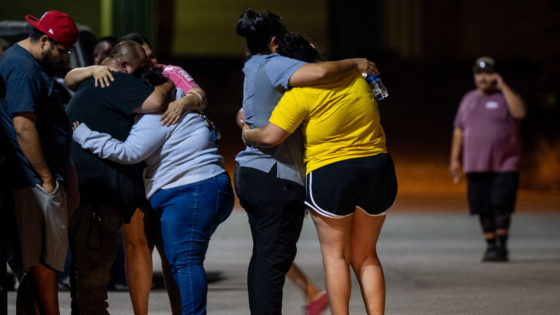 A family grieves outside of the SSGT Willie de Leon Civic Center following the mass shooting at Robb Elementary School on May 24, 2022 in Uvalde, Texas.
