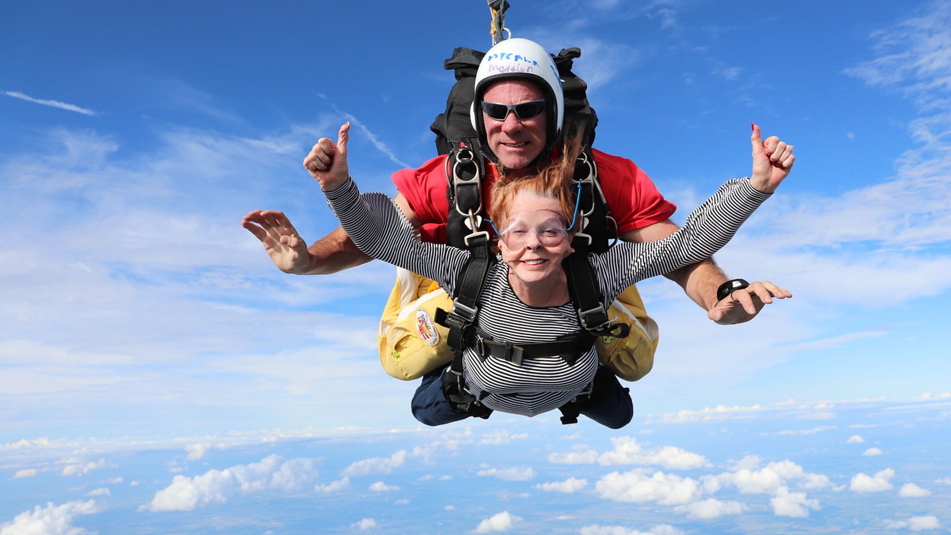 A photo of Roxanne Conlin skydiving.