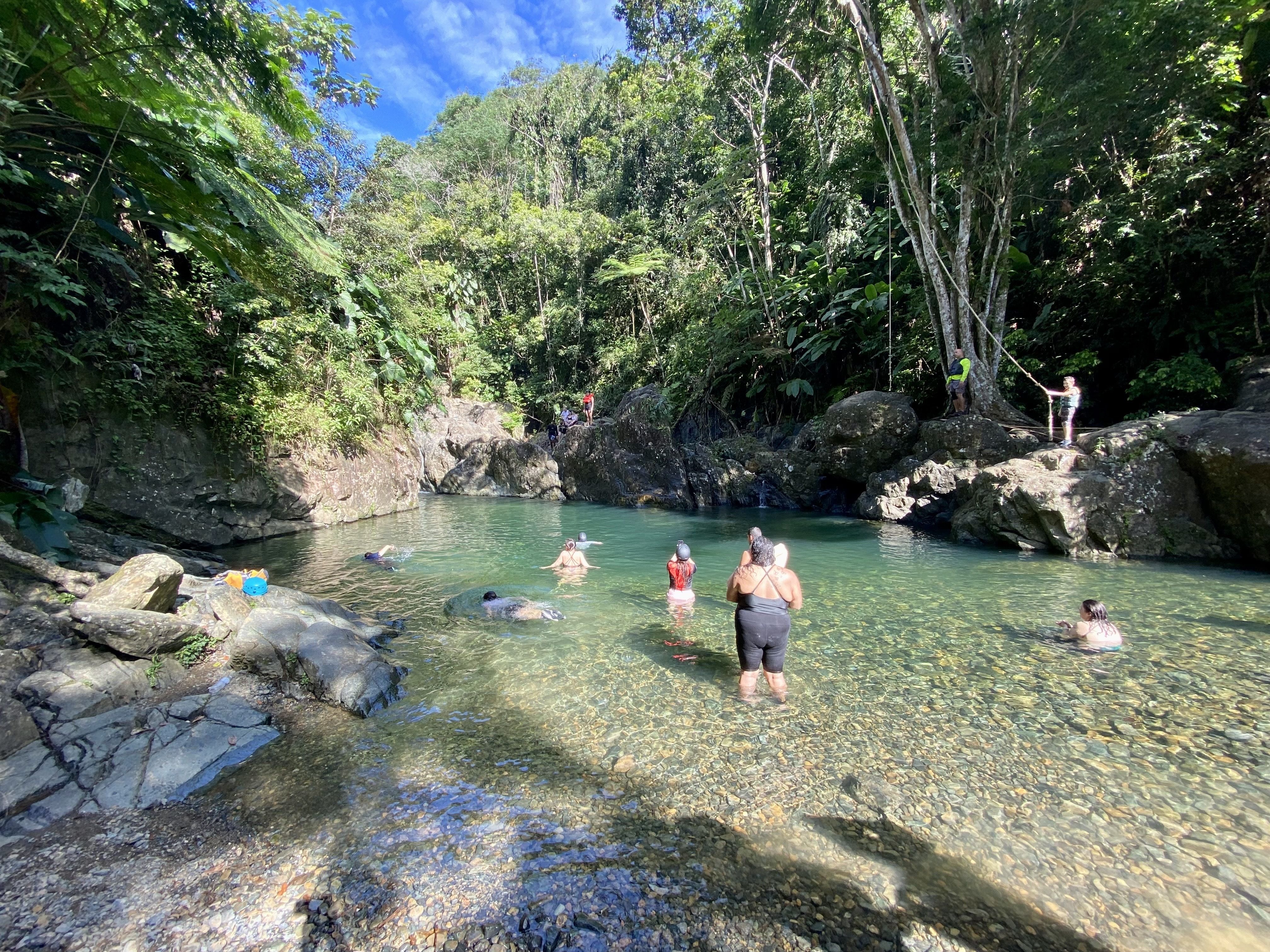 People swim at a spring.