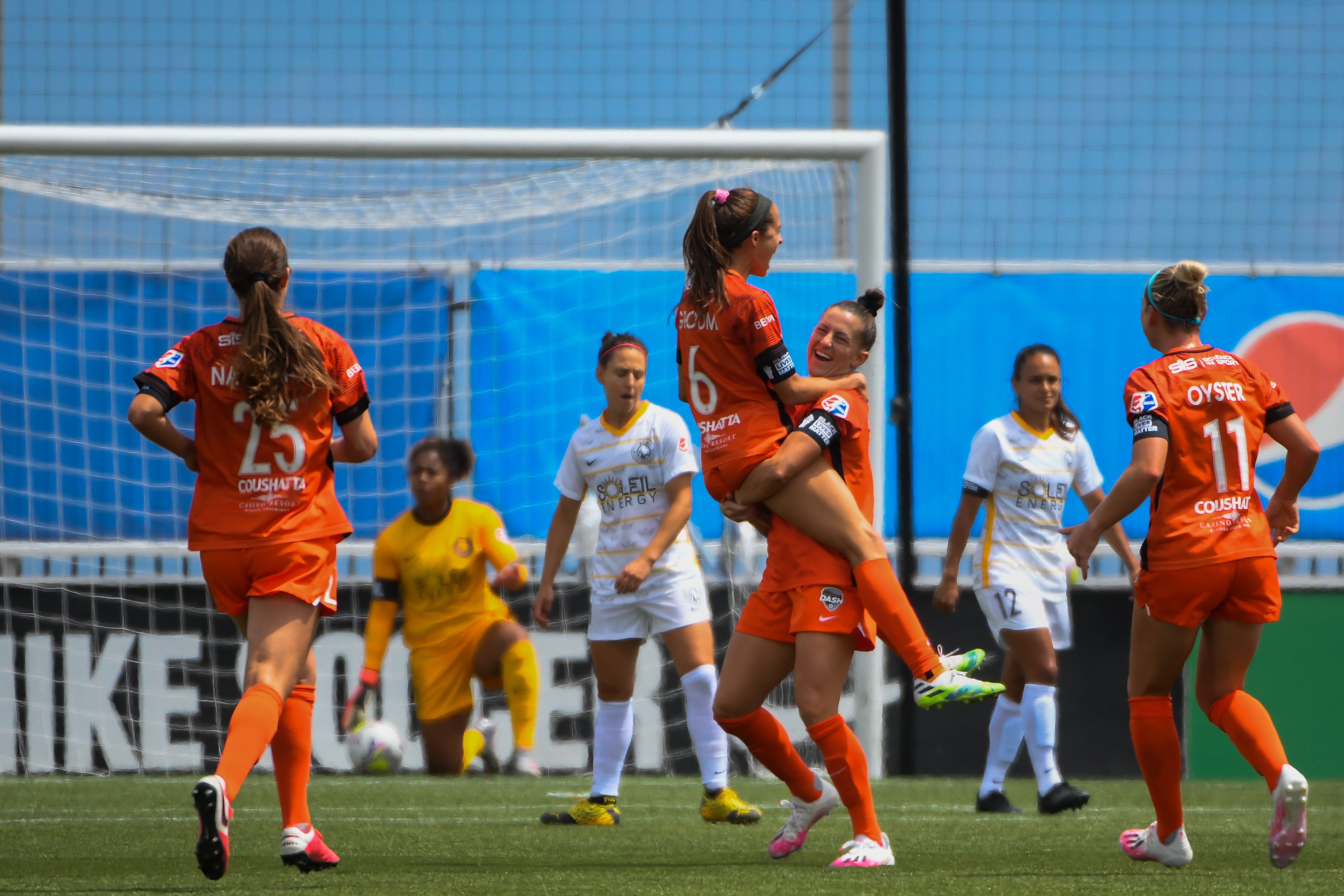 NWSL teammates celebrating