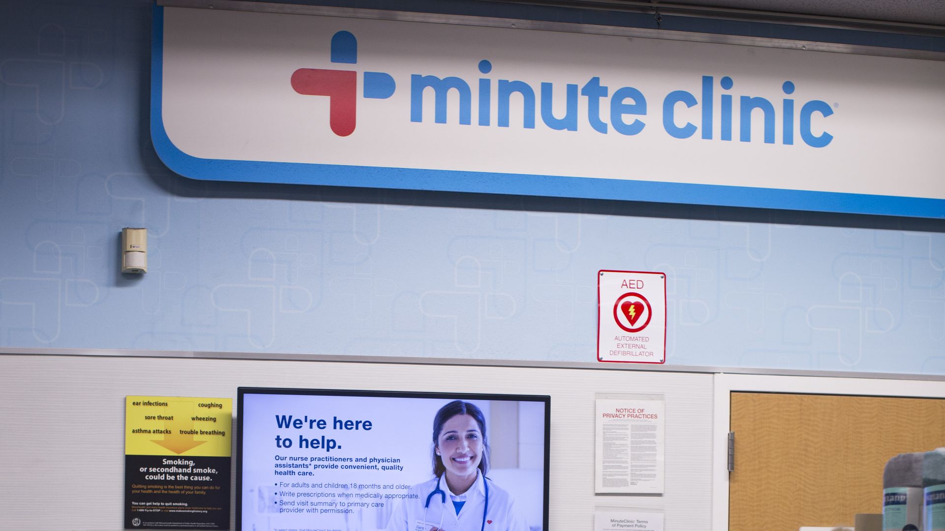 A woman waits outside of a CVS MinuteClinic.