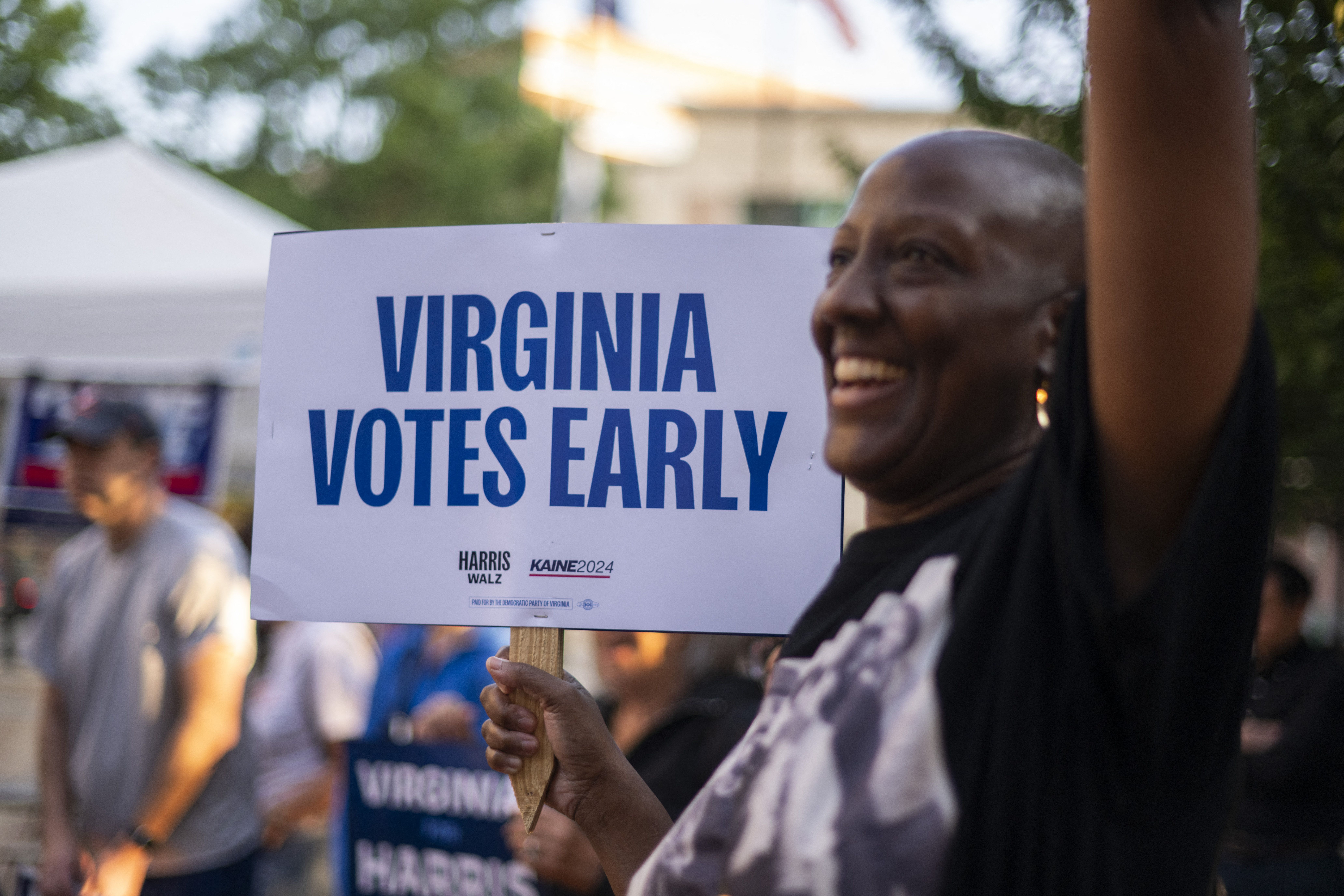 Voters arrive to cast their ballot as early voting starts in the US national elections in Arlington, Virginia, on September 20, 2024. Early in-person voting for the 2024 US presidential election began in Virginia, South Dakota and Minnesota. (Photo by AFP) (Photo by -/AFP via Getty Images)