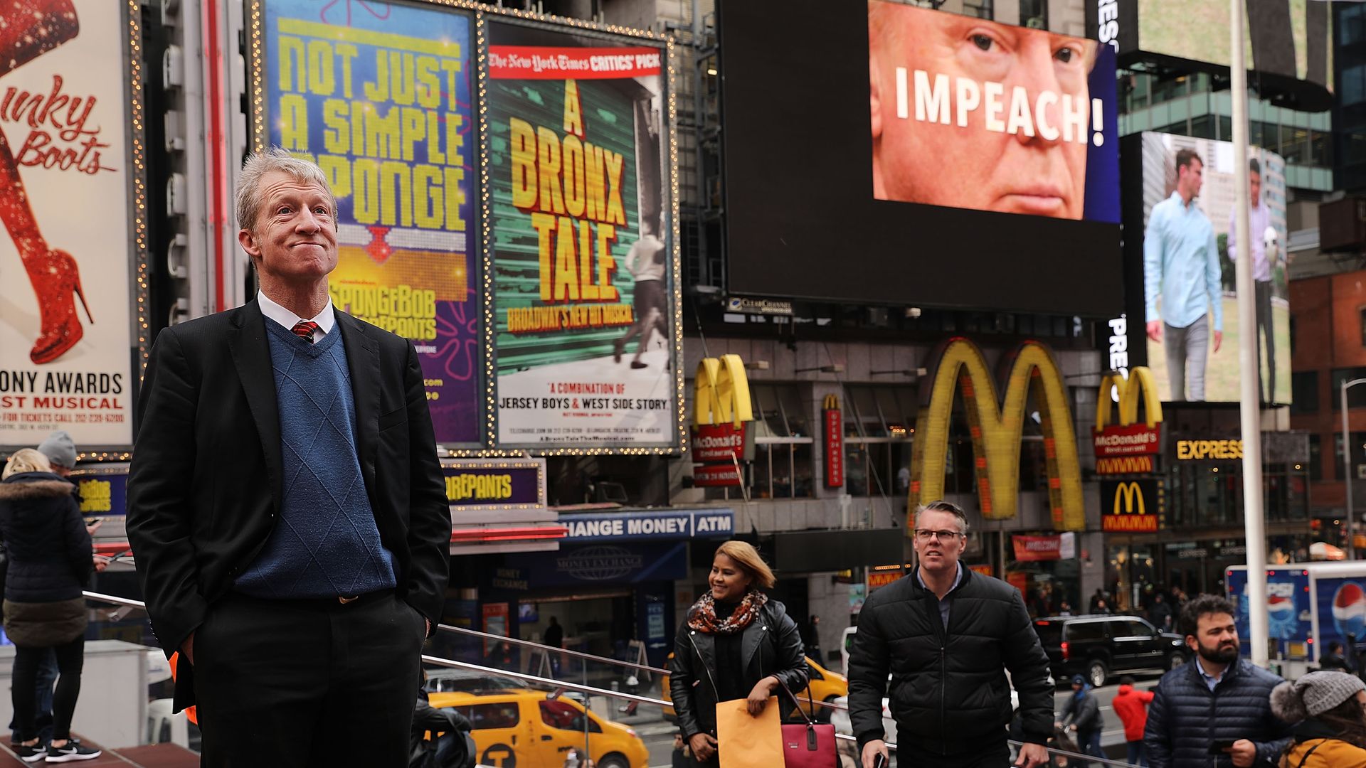 Tom Steyer standing in the middle of Times Square in New York