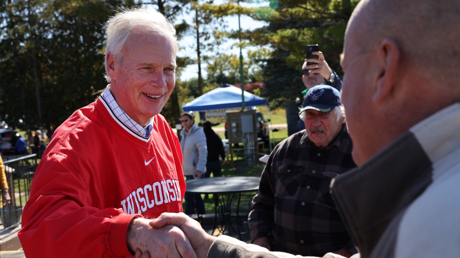 Sen. Ron Johnson (R-WI) greets people during a campaign stop 