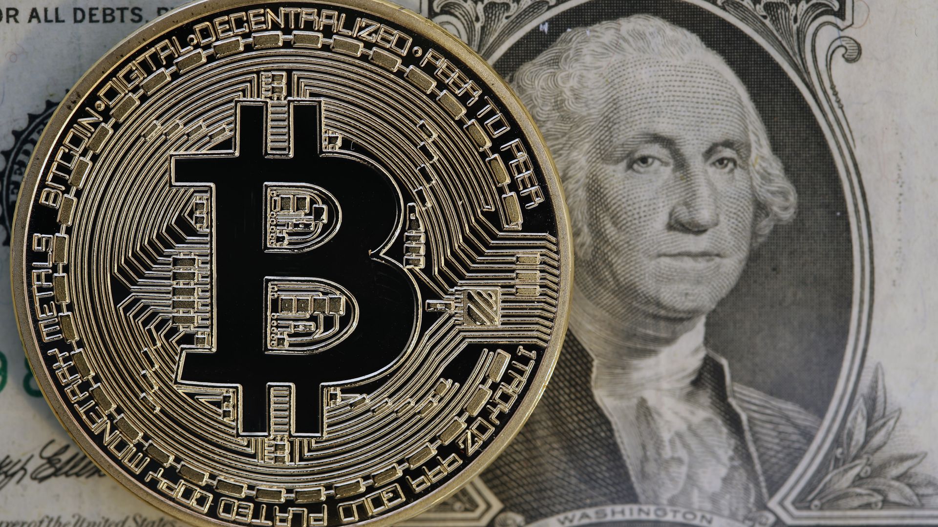 Bitcoin and a dollar bill