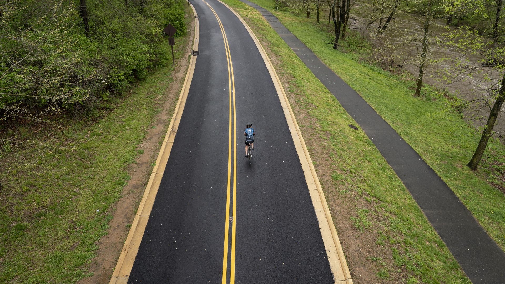 A cyclist rides on Beach Drive