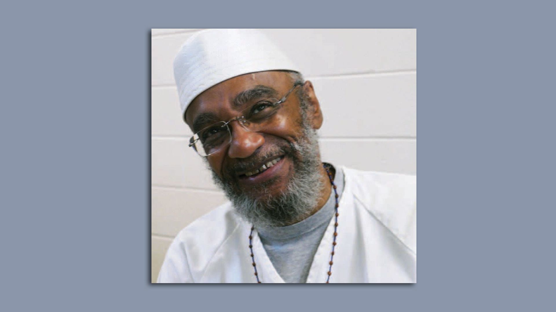 A headshot of smiling inmate Abu-Ali Abdur'Rahman. 