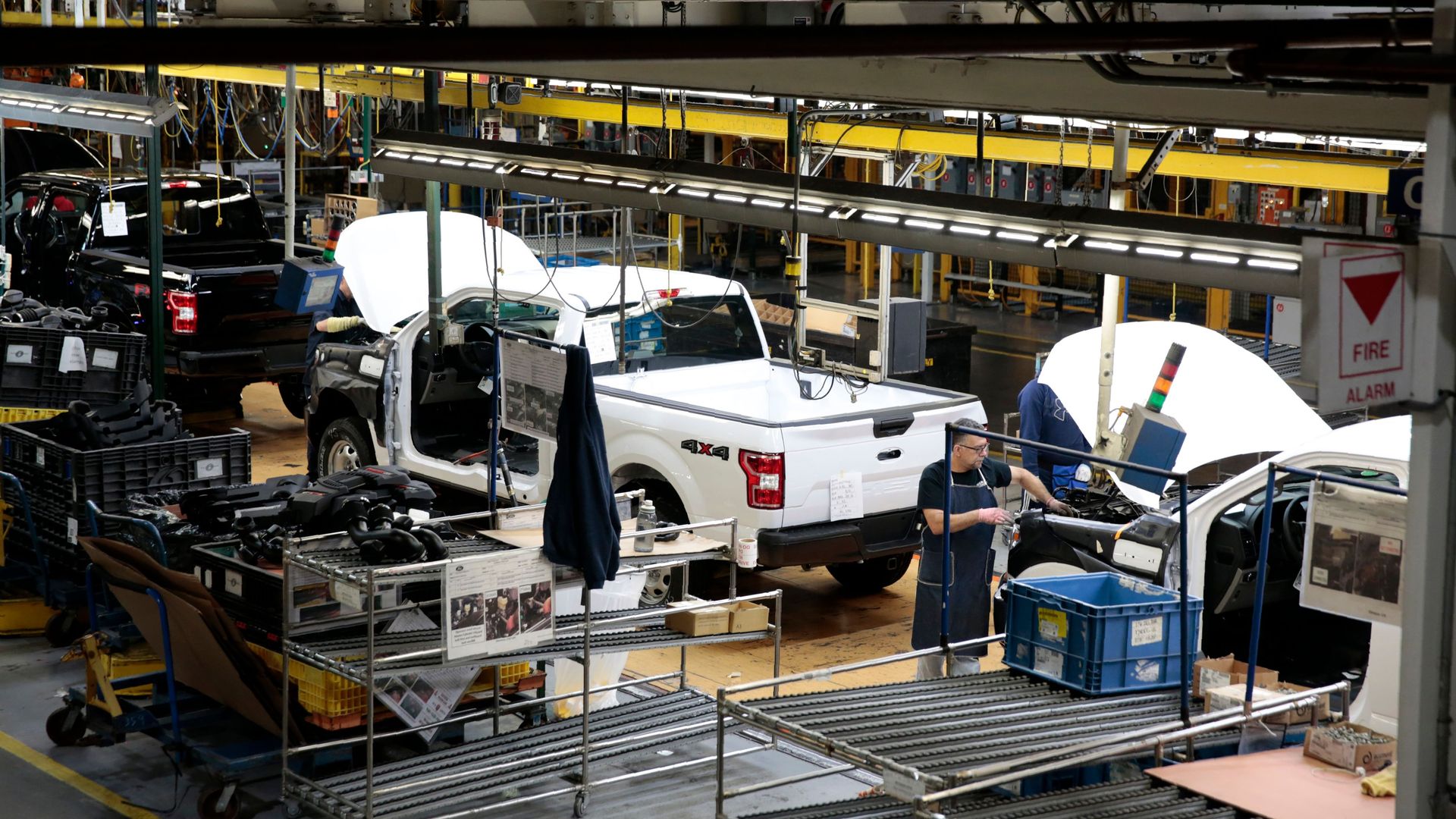 ford trucks on an assembly line in a manufacturing plant