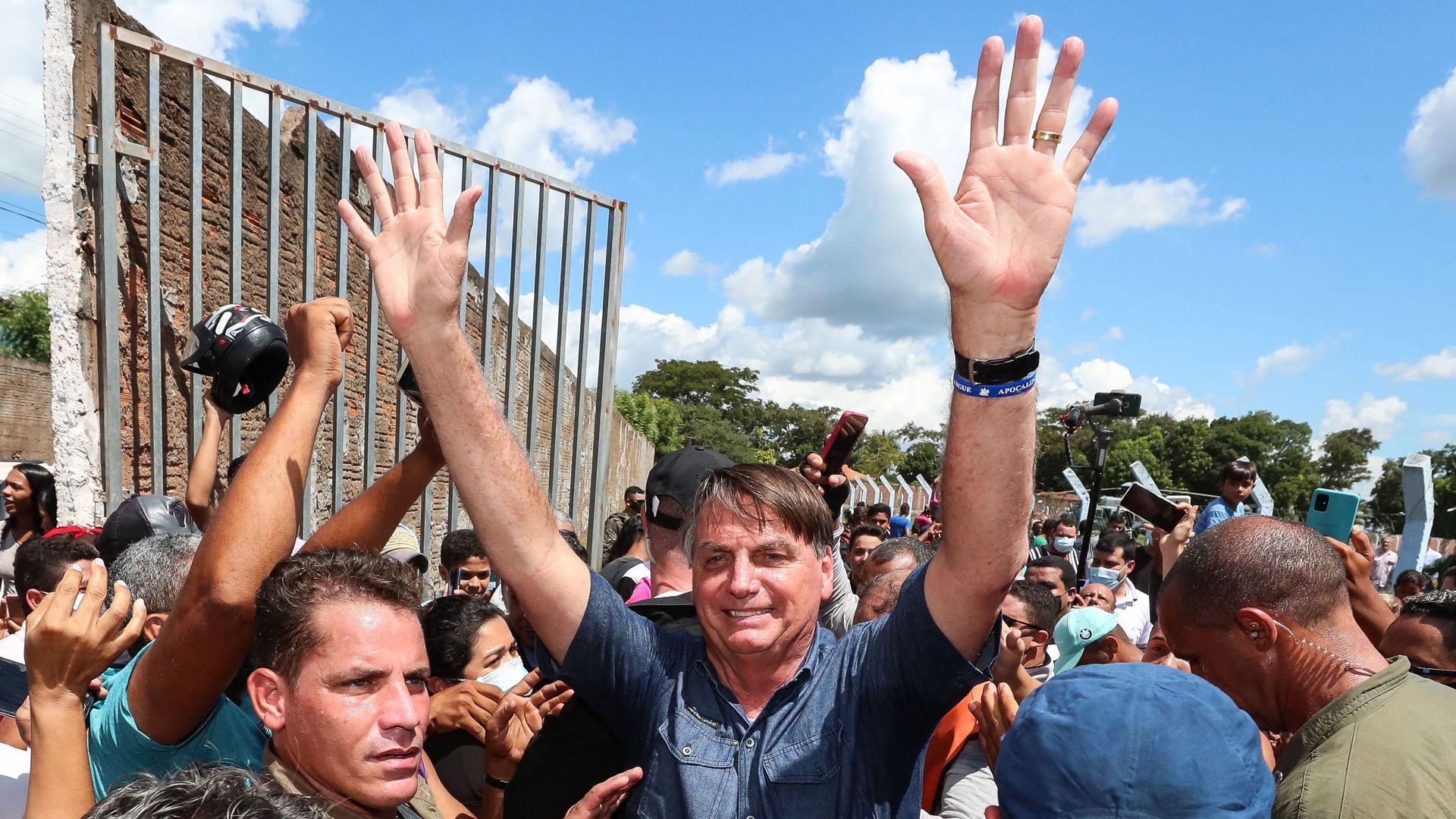 Handout photo released by the Brazilian Presidency of President Jair Bolsonaro greeting a crowd during a non-schedule visit to the city of Senador La Rocque, Maranhao state, Brazil, on May 21,