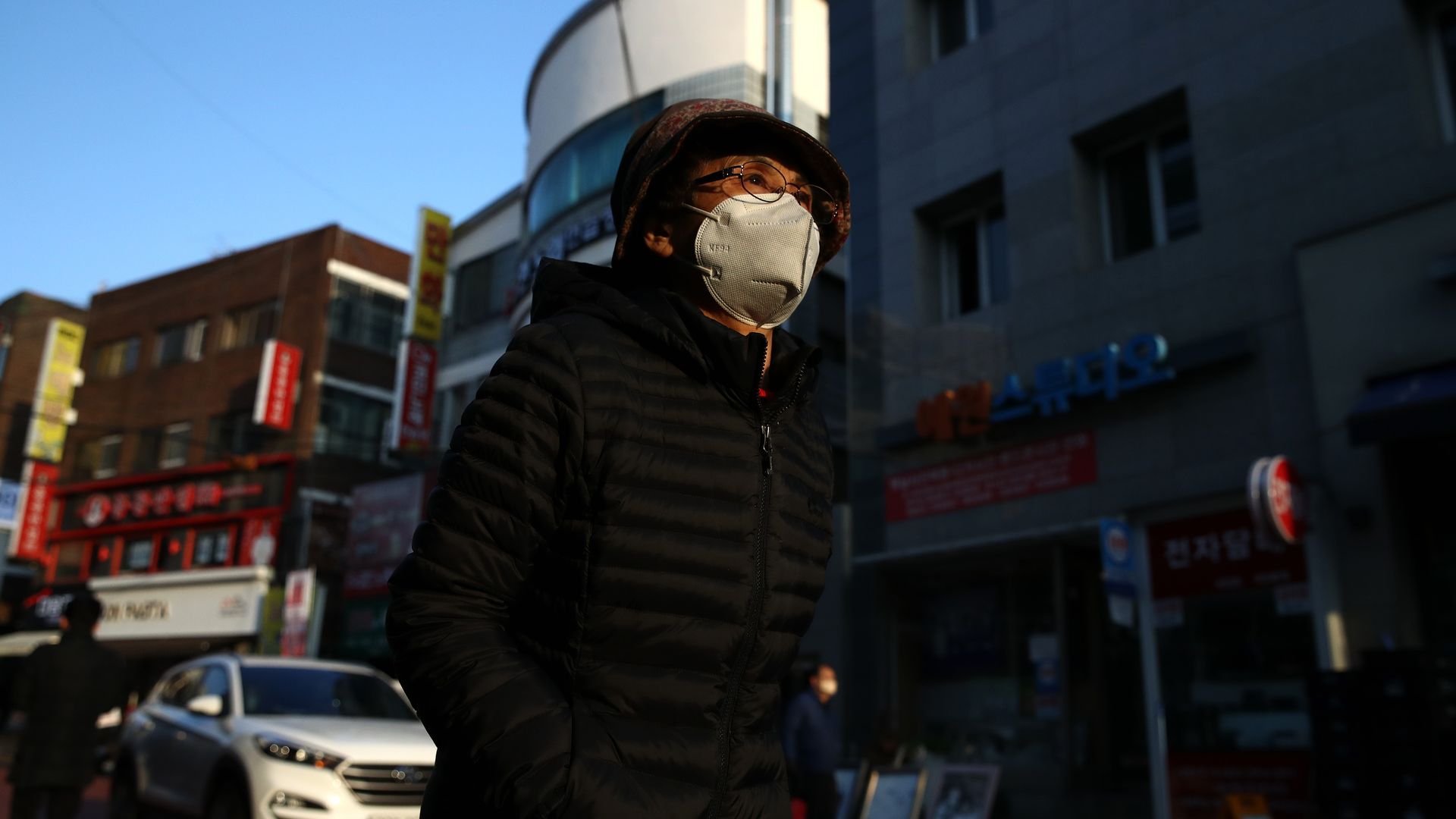 Picture of a woman in South Korea wearing a mask