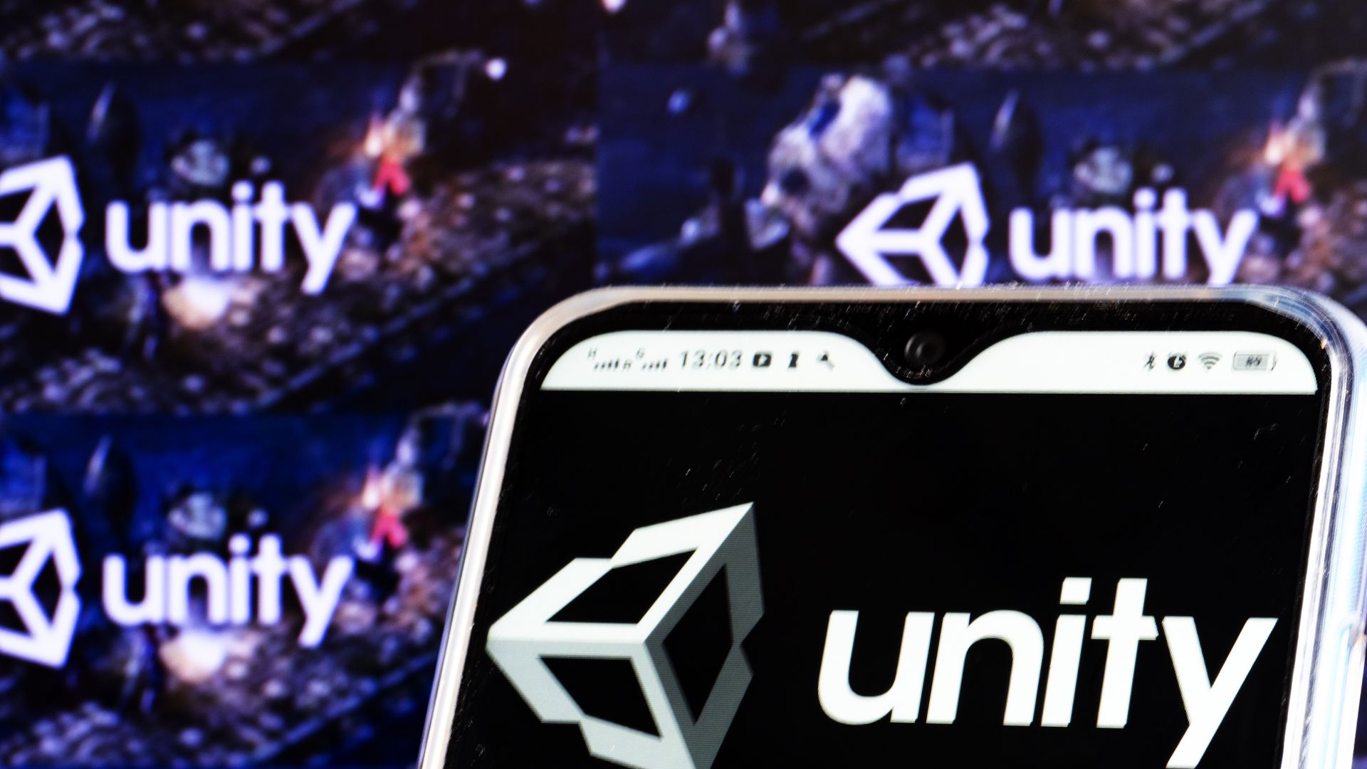 Photo of a phone with a Unity logo on it