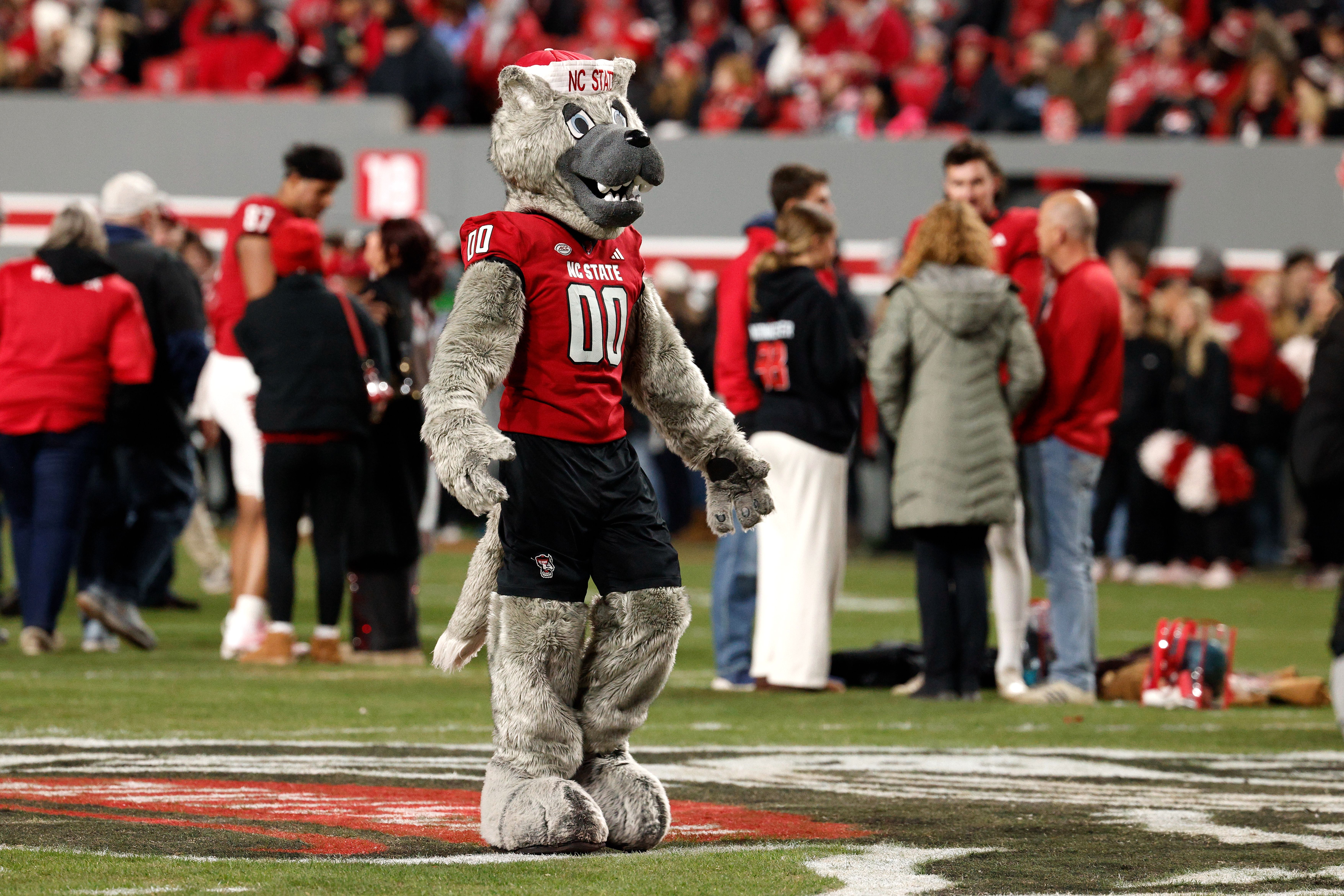 Mr. Wuf, mascot of the NC State Wolfpack, performs during the game against the North Carolina Tar Heels at Carter-Finley Stadium on November 29, 2025 in Raleigh, North Carolina. (Photo by Lance King/Getty Images)