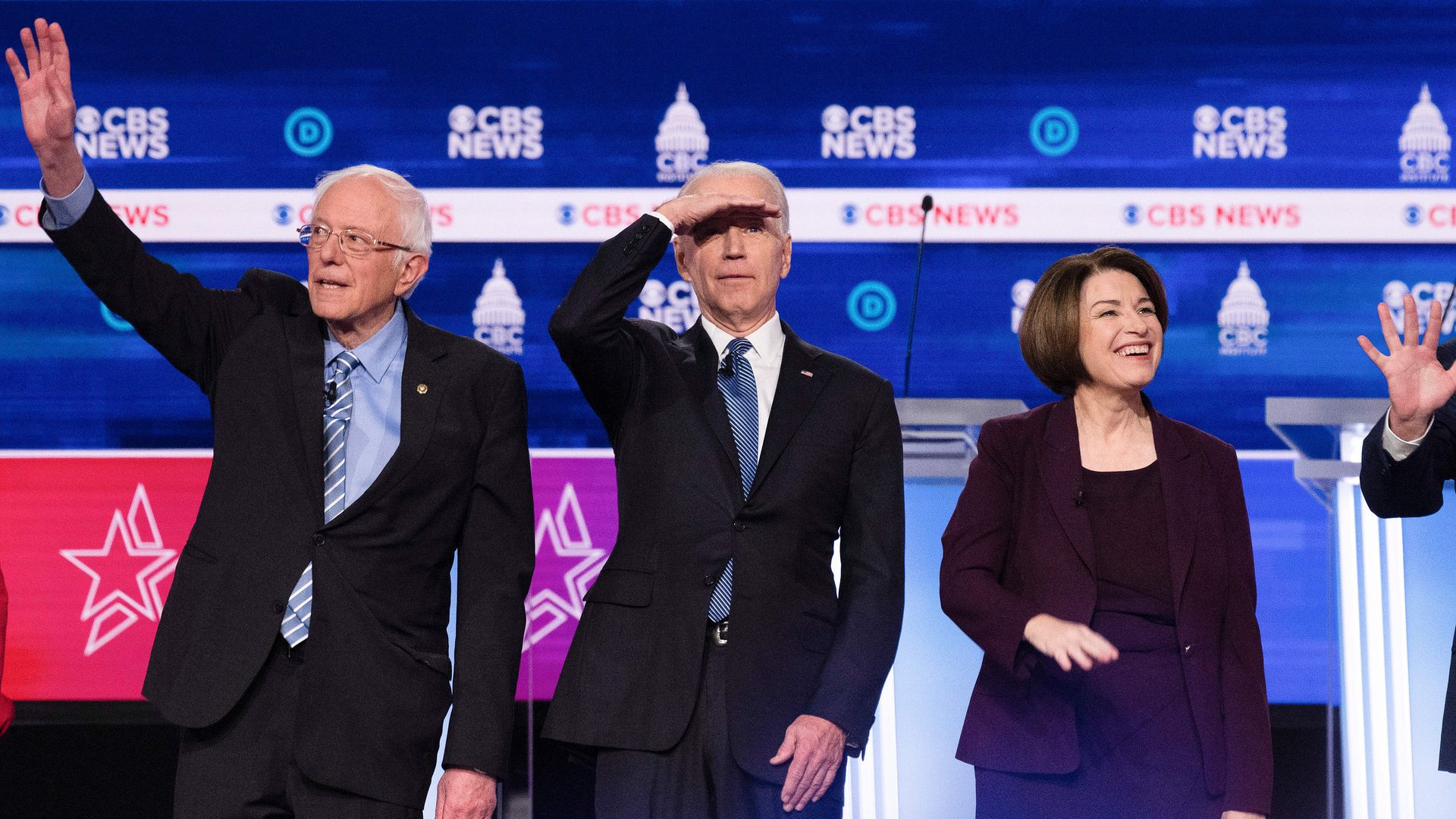 In this image, Bernie, Biden, Kobuchar and Steyer stand on stage