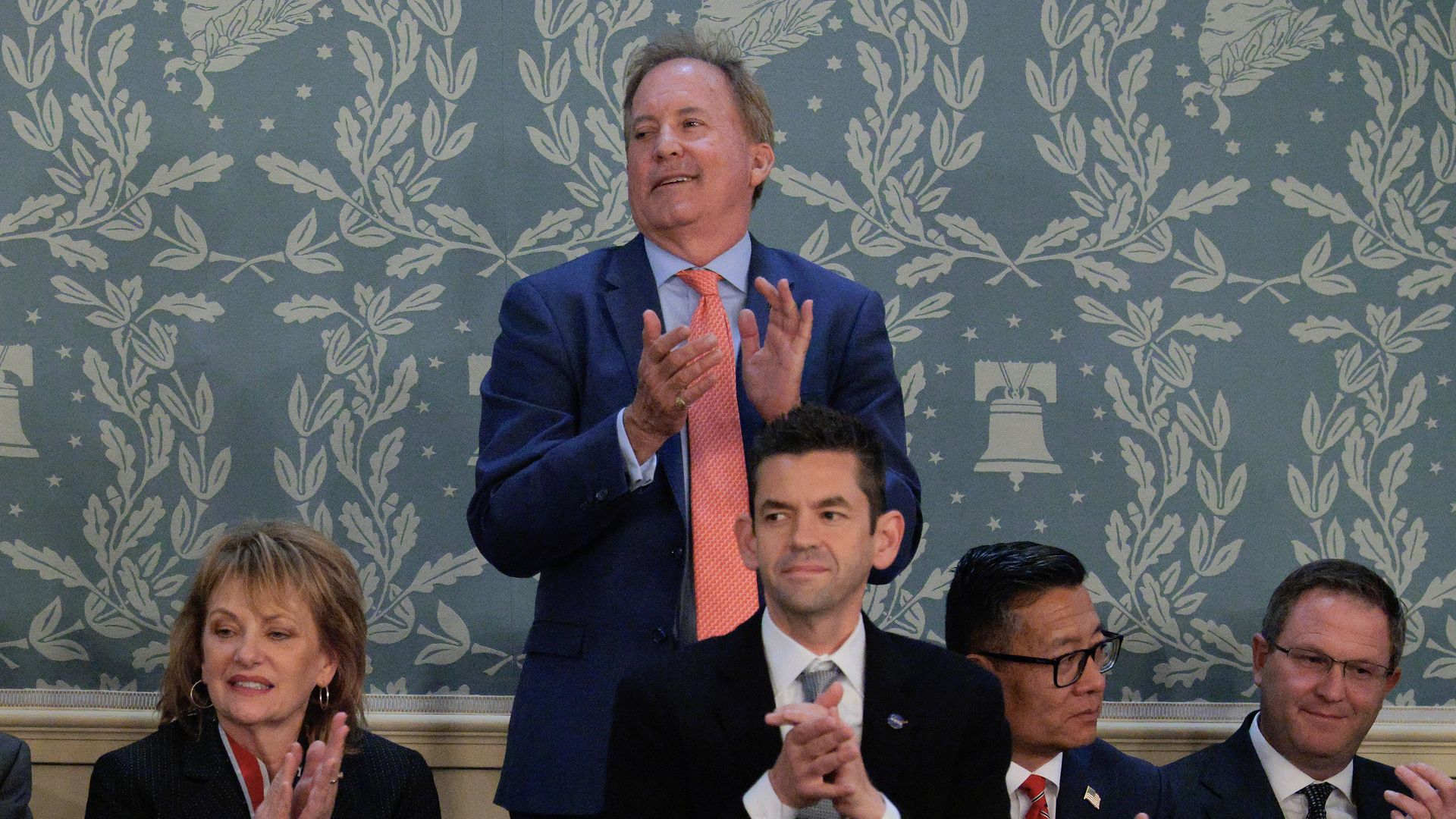 Texas Senate candidate Ken Paxton applauds at President Trump's State of the Union address in February.