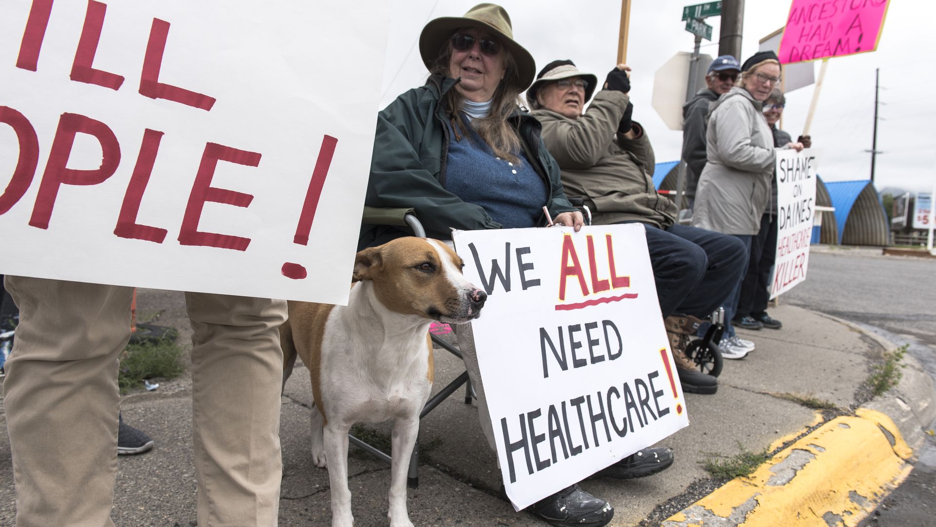 A group of people protest in favor of health care