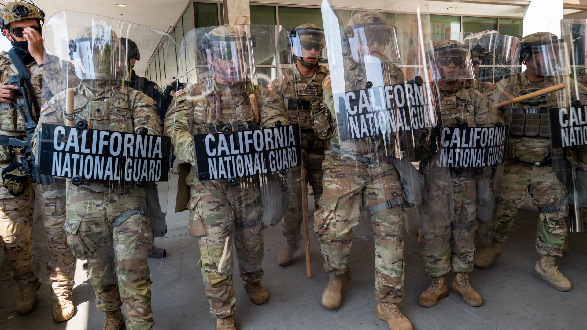 Protesters confront National Guard soldiers outside of a federal building in Los Angeles.