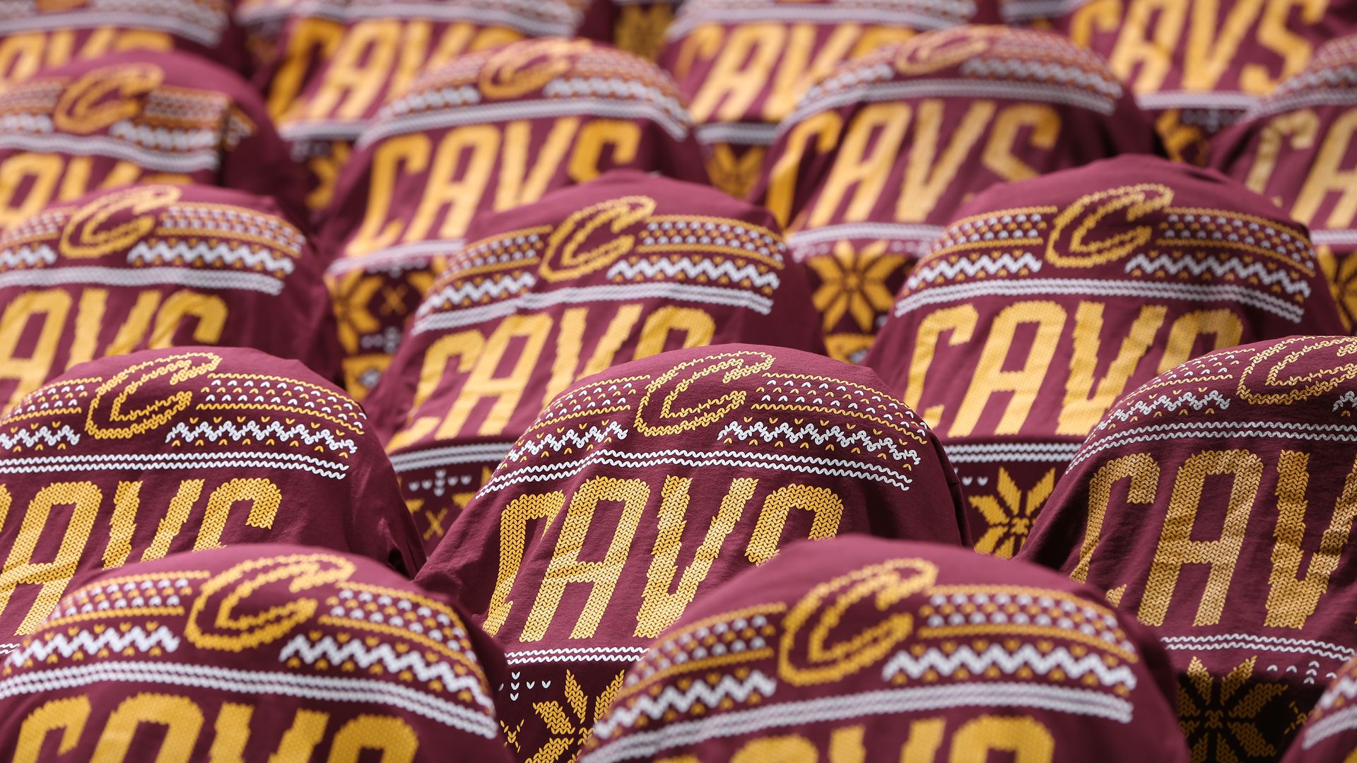 Christmas-themed Cavs t-shirts draped on seats