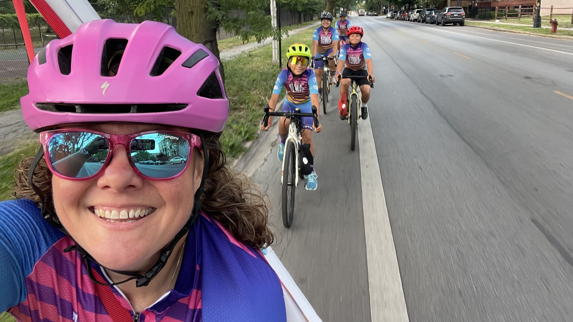 Sunnie riding her bike in a bike lane