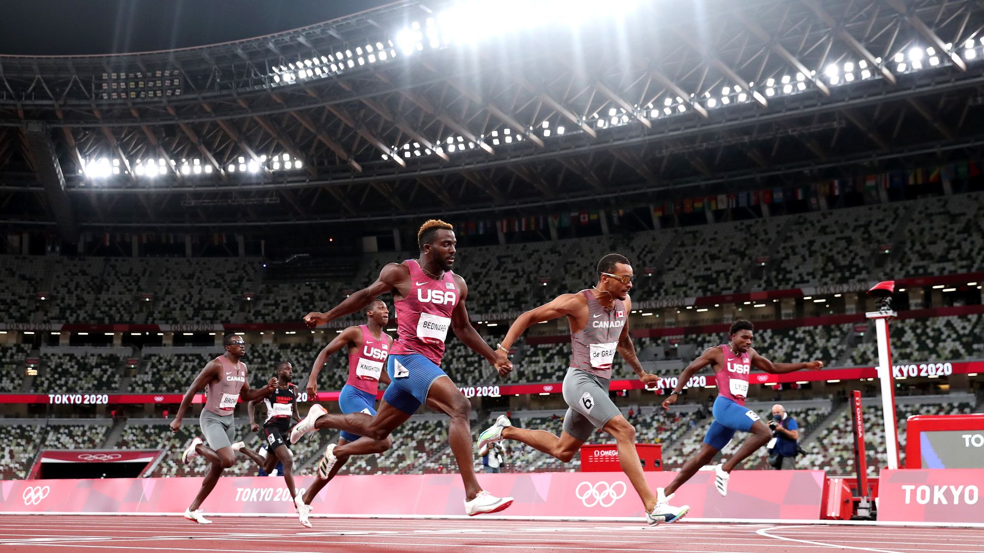 Andre de Grasse of Team Canada finishes ahead of Kenneth Bednarek of Team United States to win the gold medal in the Men's 200m Final