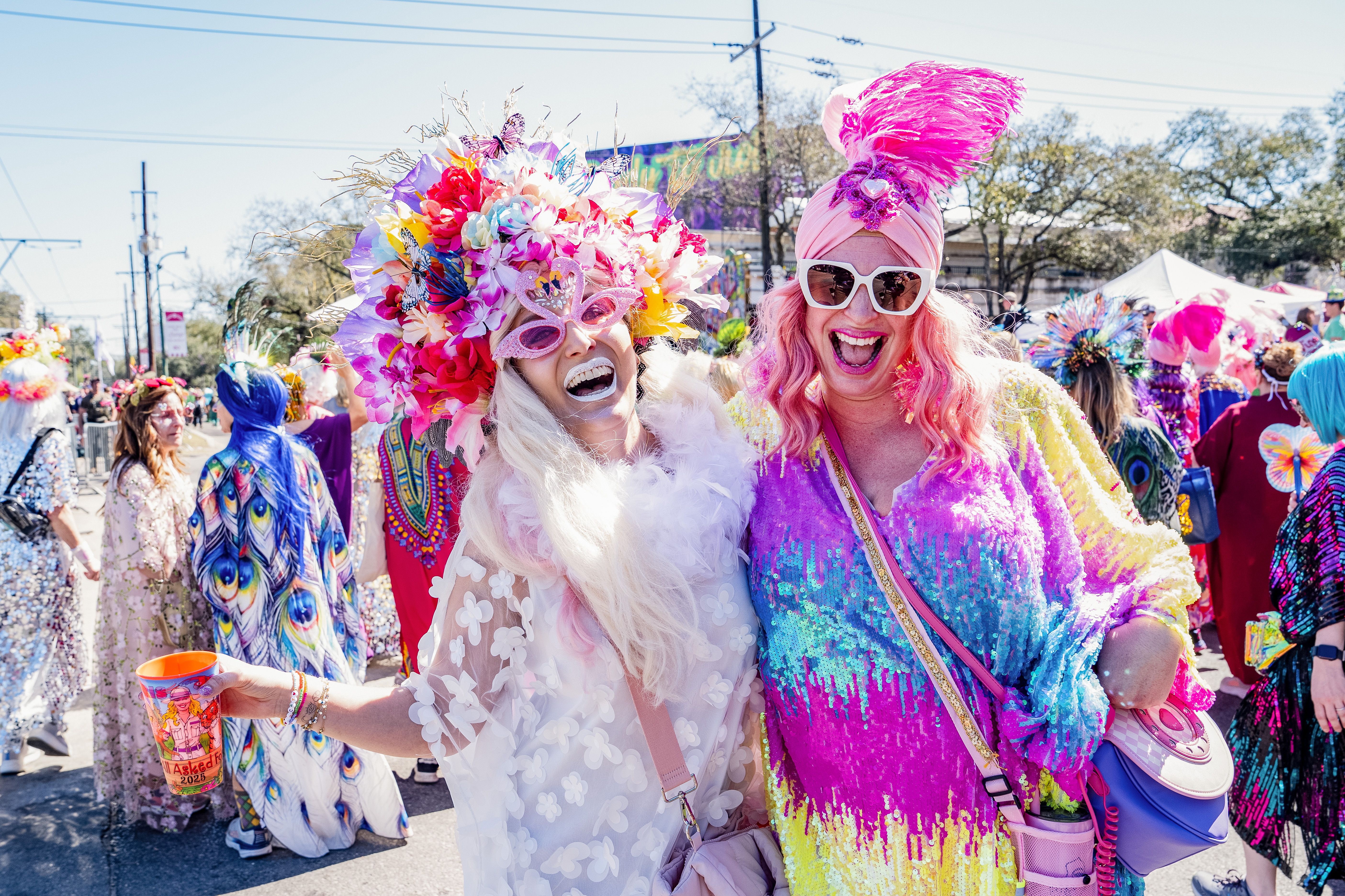 Photo shows two people with kaftans on.