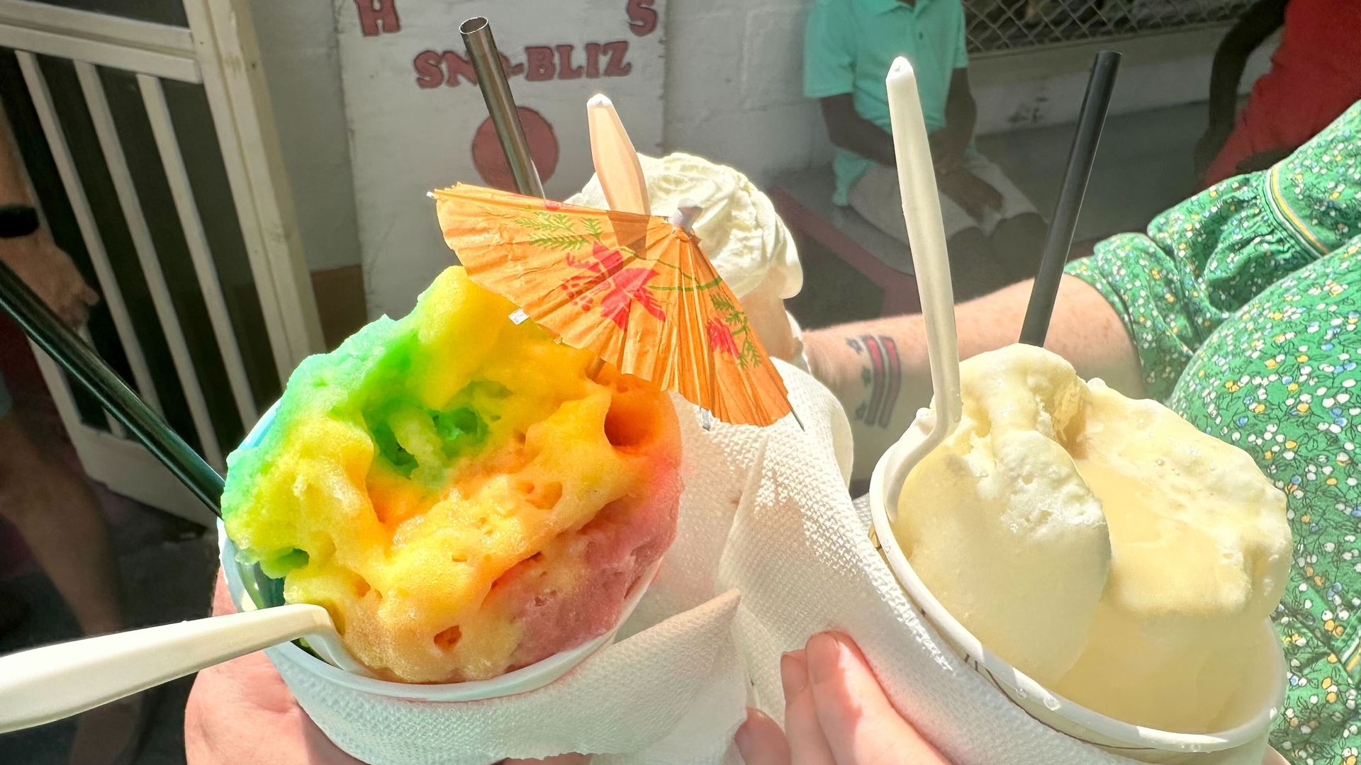 Photo shows snoballs with umbrellas.