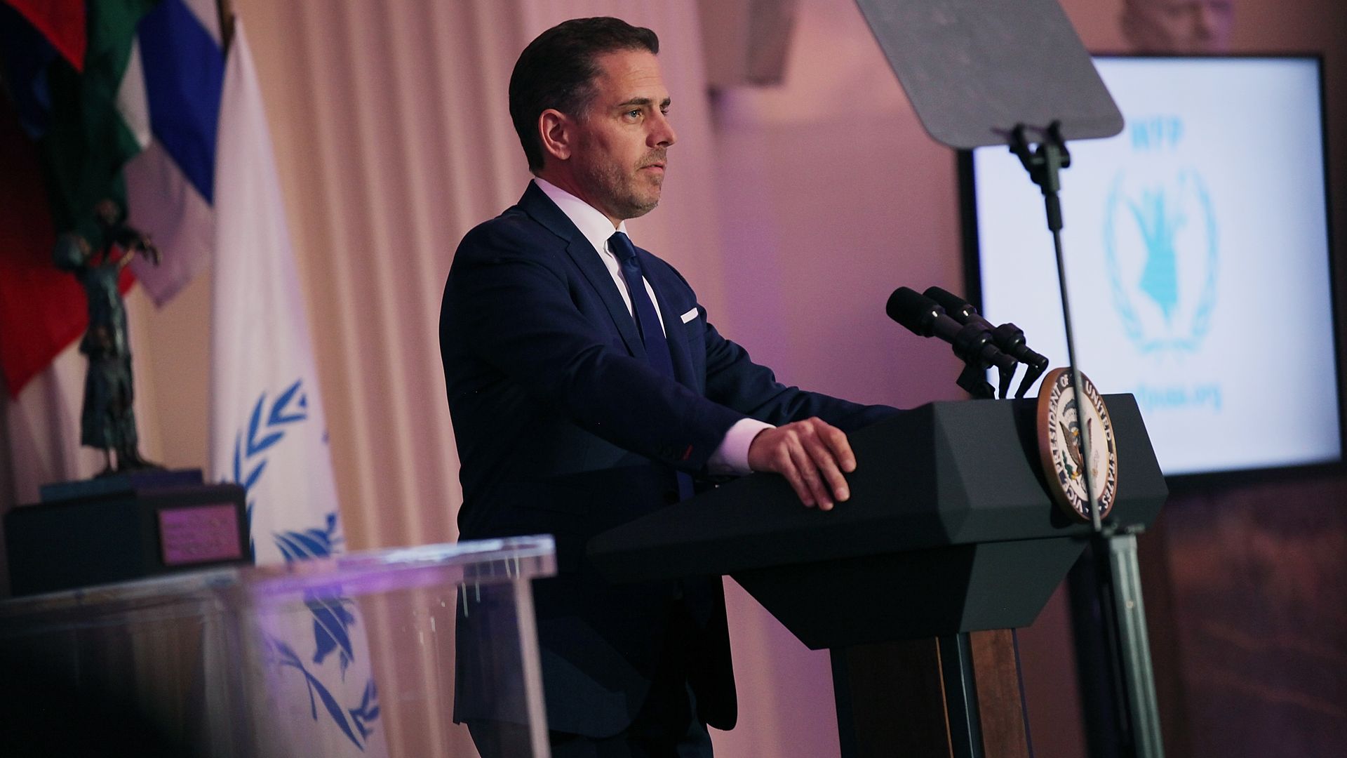 Hunter Biden stands in front of a podium