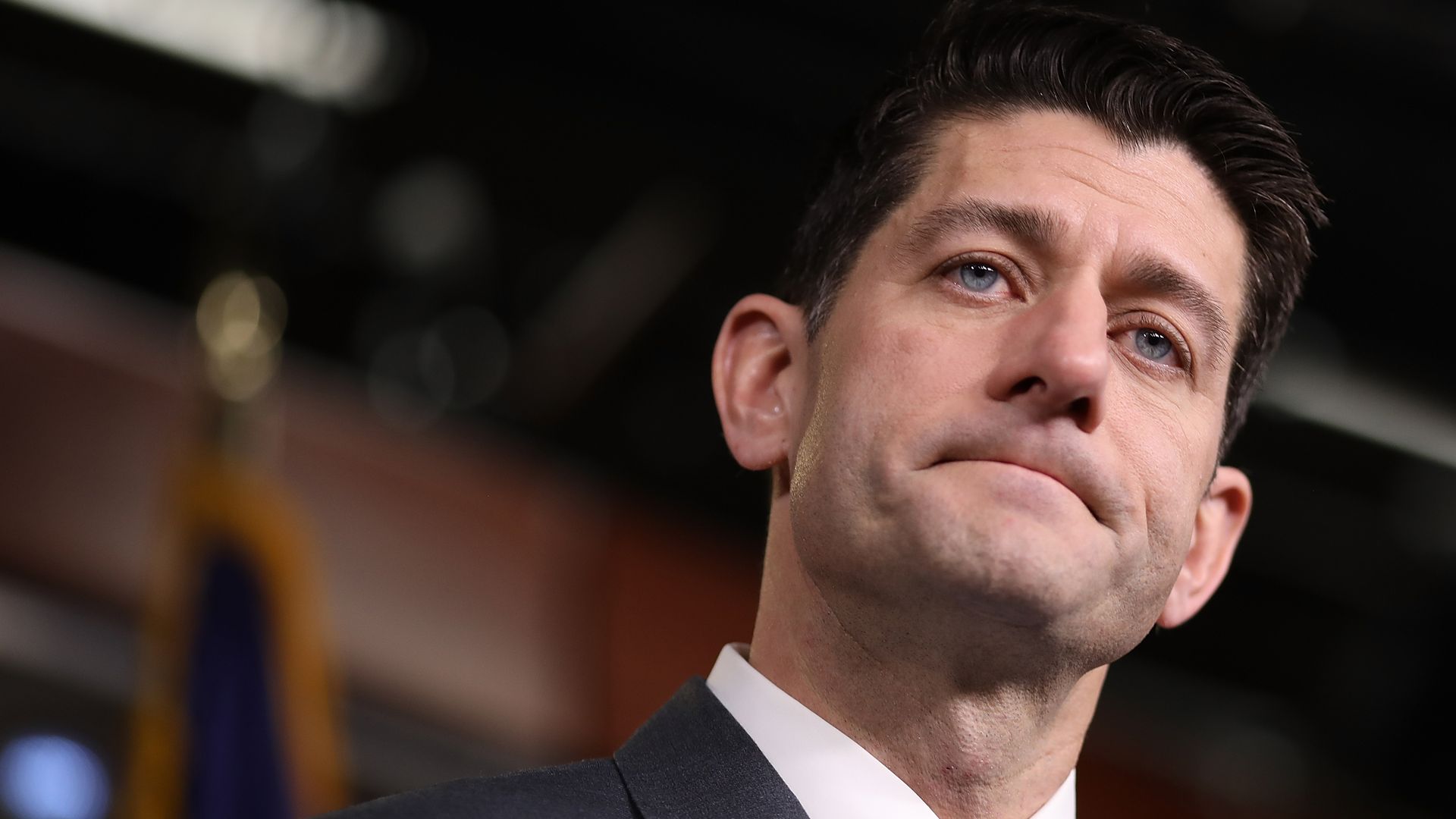 A closeup photo of Paul Ryan's face, in which he is almost frowning