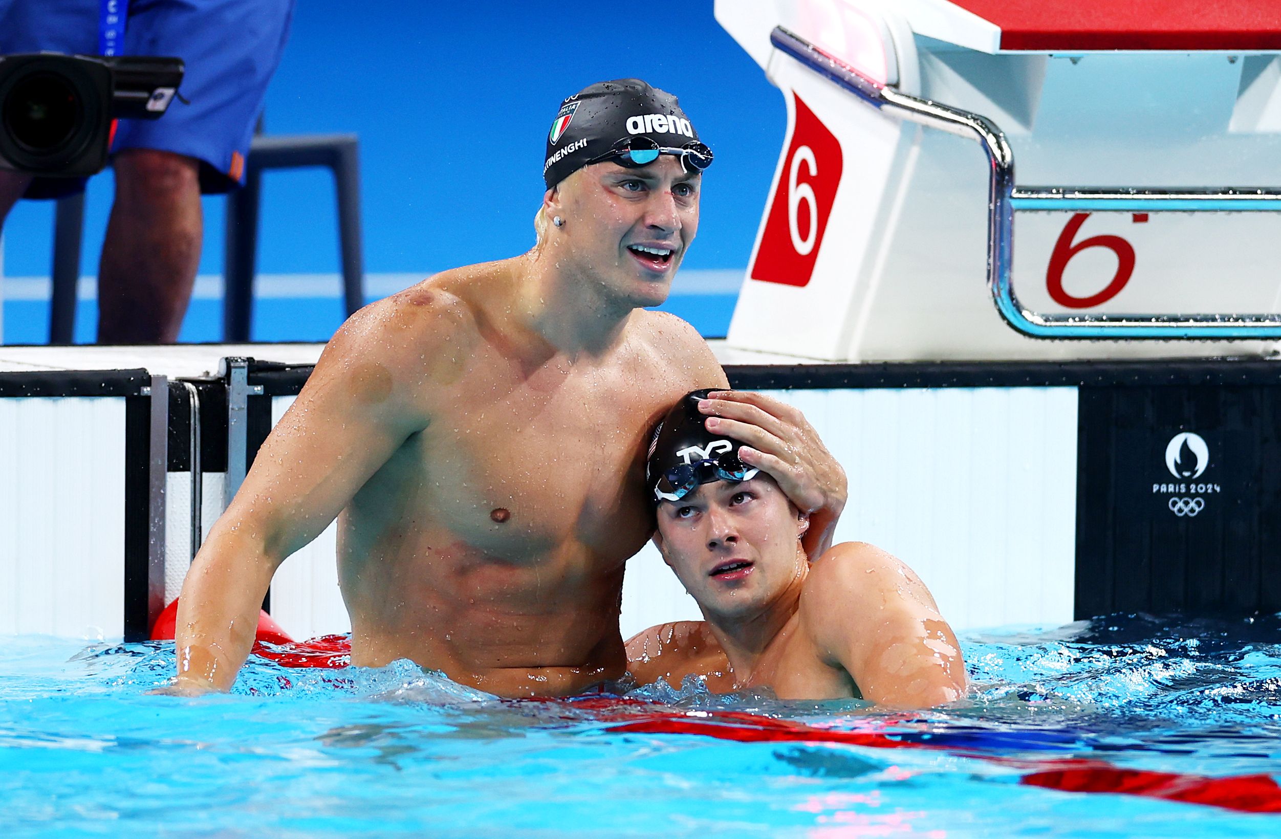 Nic Fink, of Team USA, who won silver, congratulates Italy's Nicolo Martinenghi after for winning gold in the Men's 100m Breaststroke Final on day two of the Olympic Games Paris 2024 at Paris La Defense Arena on July 28, 2024 in Nanterre, France.