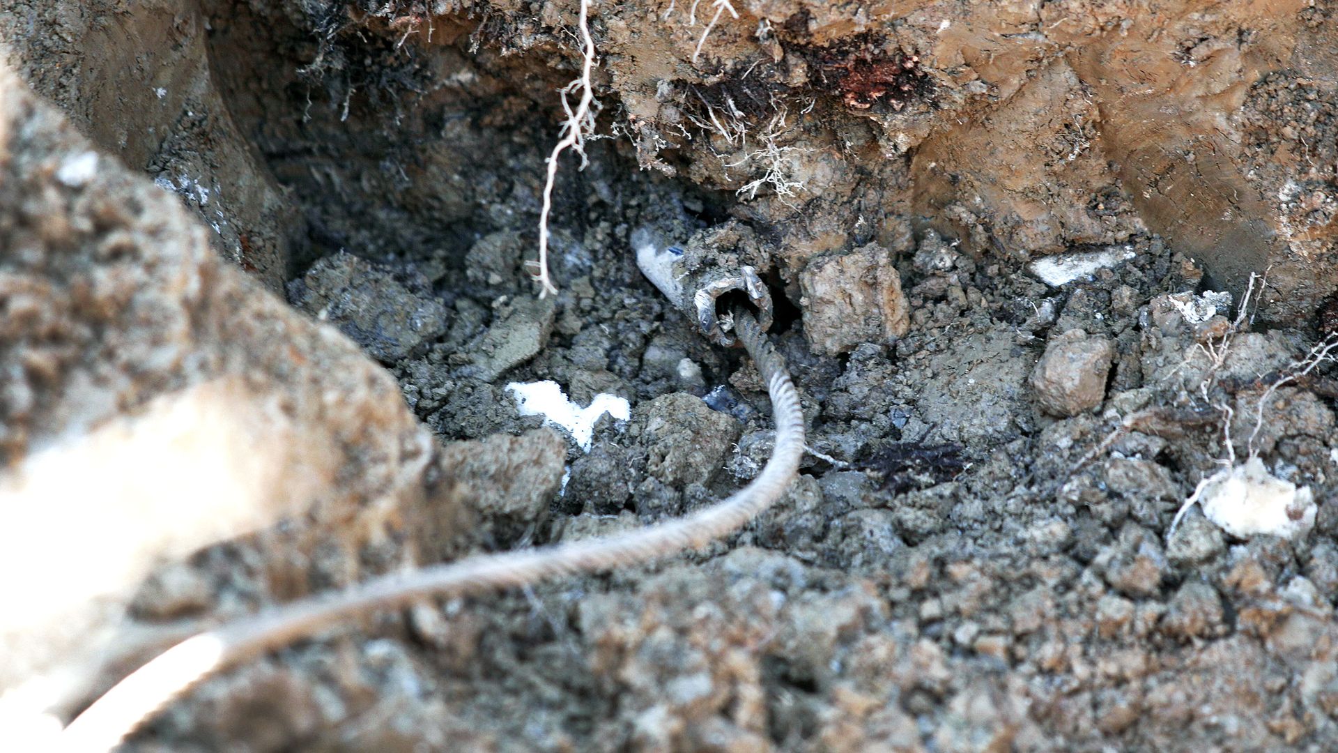 A lead service line water pipe is exposed in Flint, Michigan.
