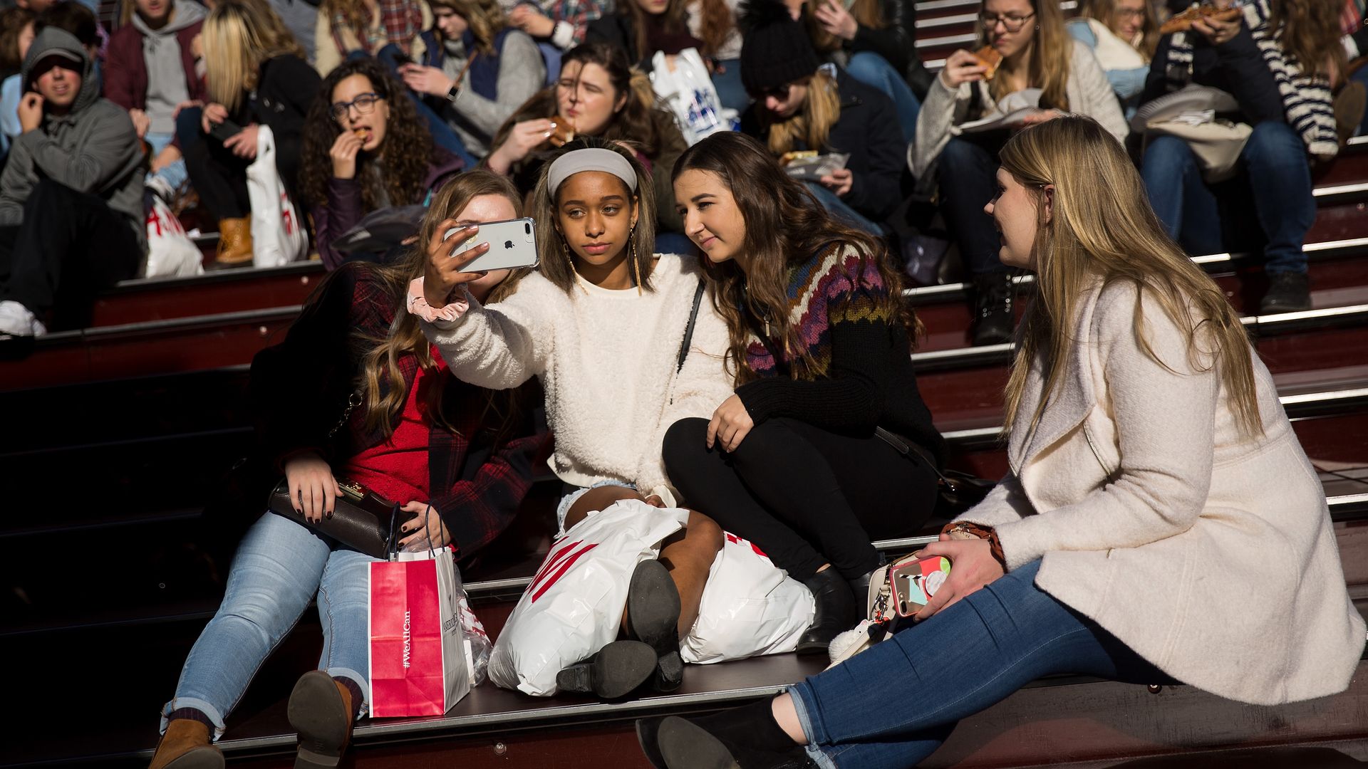 teenagers taking a selfie