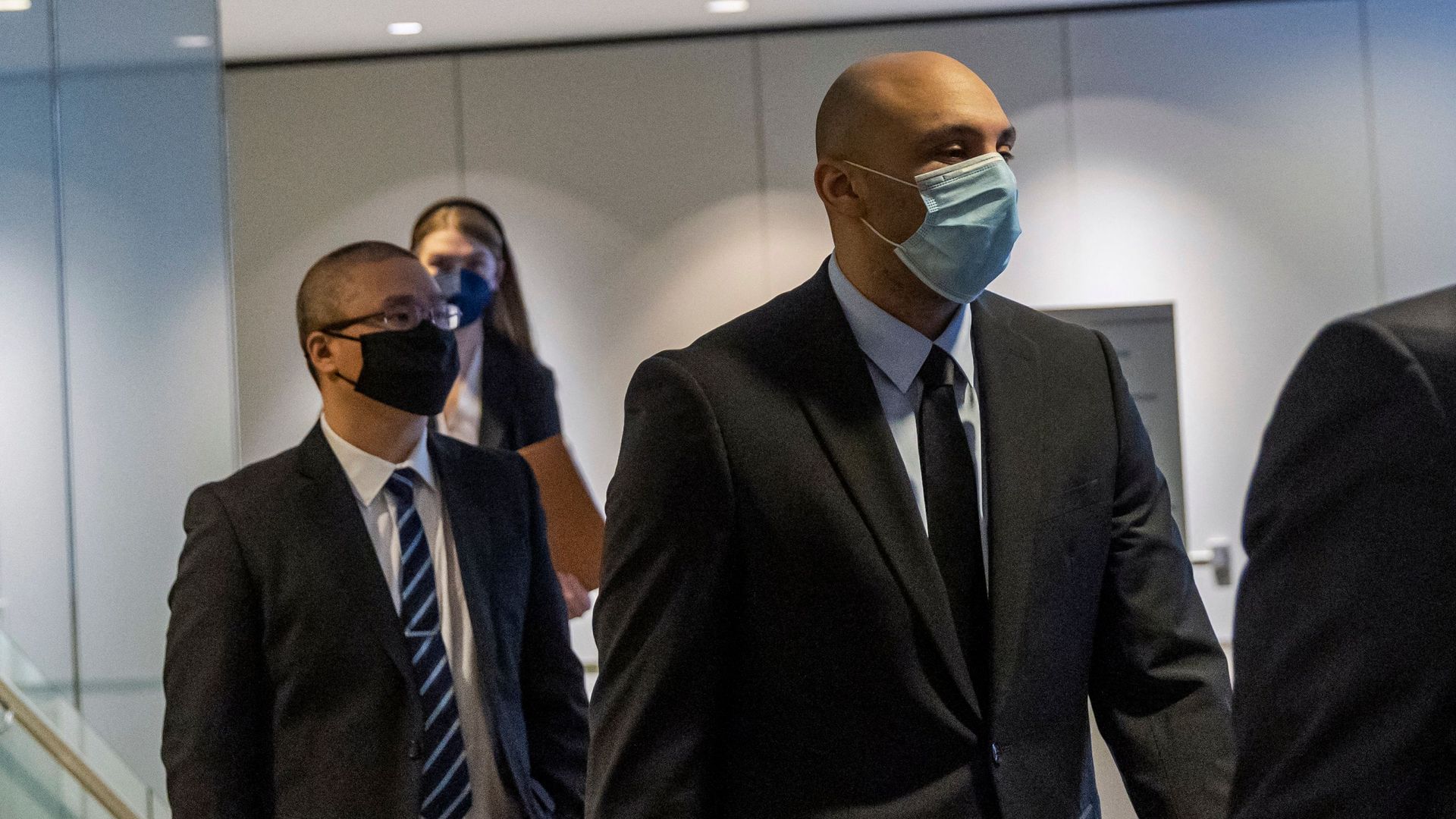 Former Minneapolis police officers Tou Thao (left) and Alexander Kueng (right) leaving a federal court in January 2022.