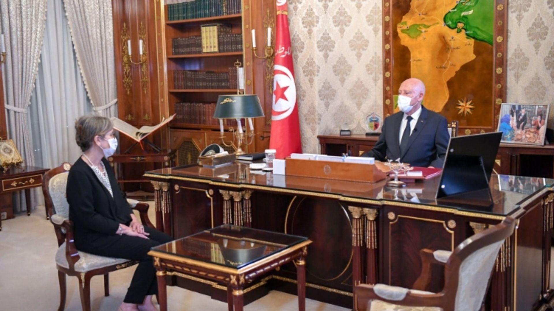 Photo of Najla Bouden Romdhane and Kais Saied.