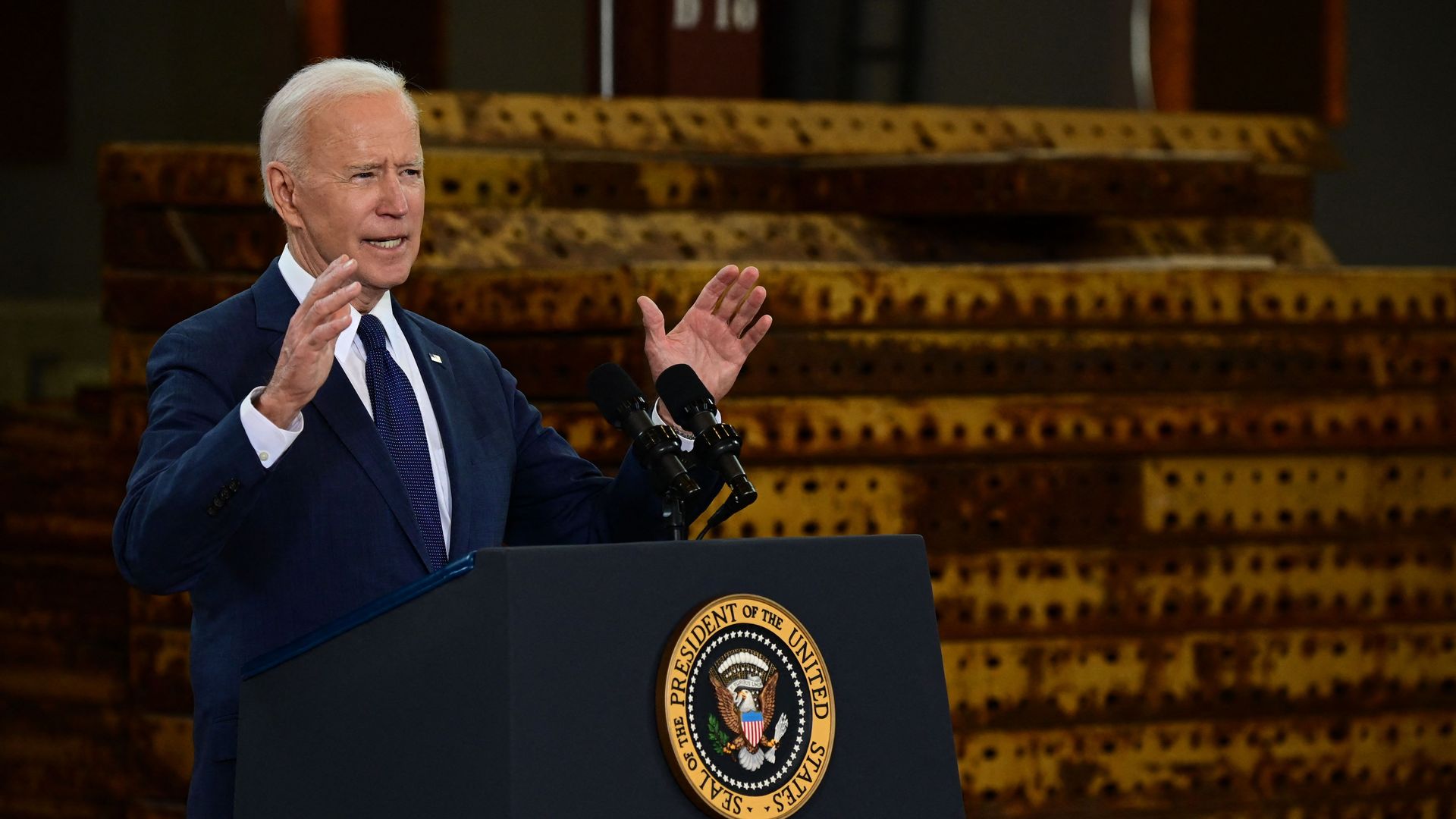 Biden speaks behind lectern