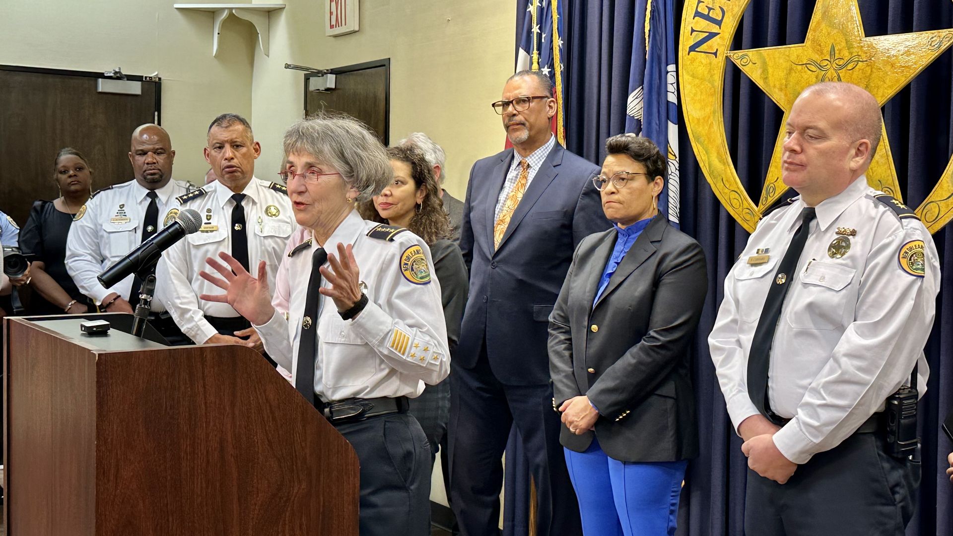 Photo shows NOPD Superintendent Anne Kirkpatrick, New Orleans Mayor LaToya Cantrell, City Council members and top police officials at a press conference.