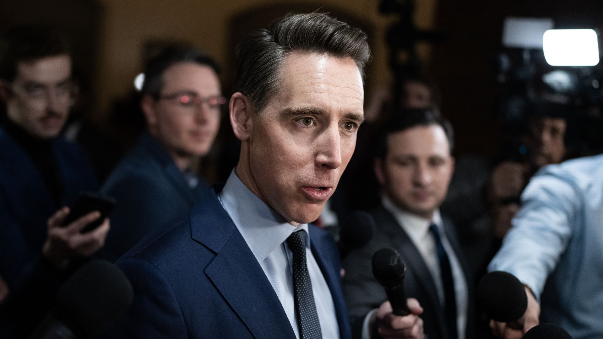  Sen. Josh Hawley, R-Mo., talks with reporters in Russell building before a senate vote 