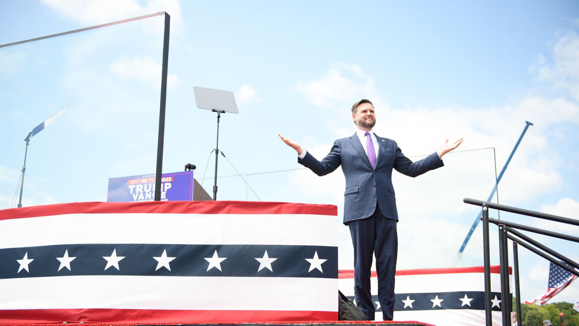 JD Vance gestures to a crowd at a campaign stop.