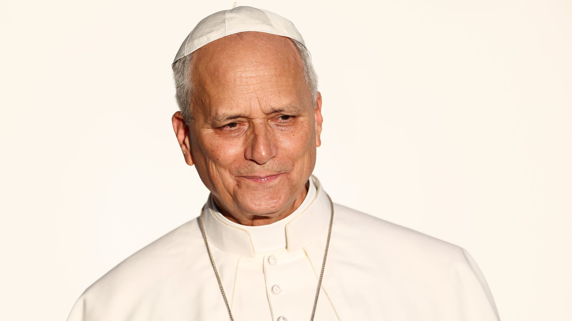 Pope Leo XIV in white robes against a white background