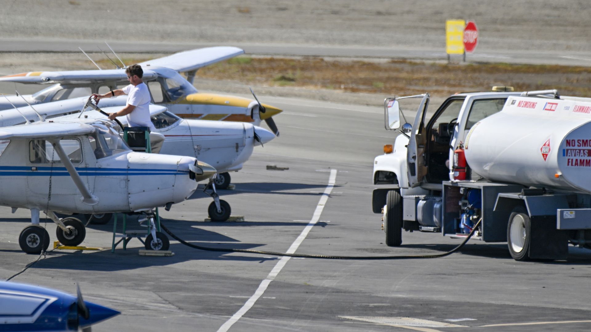 A worker fuels an aircraft at Long Beach Airport on Monday, September 12, 2022.