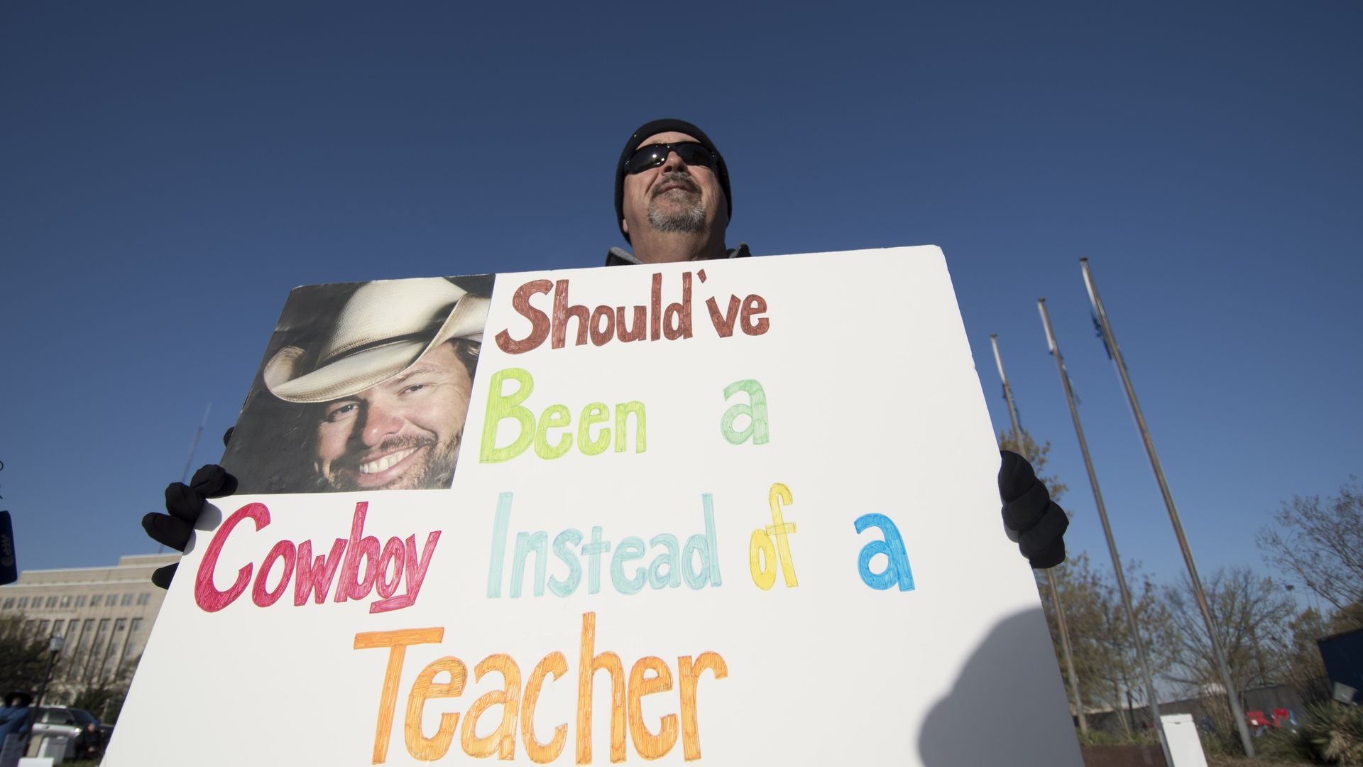 A teacher protesting