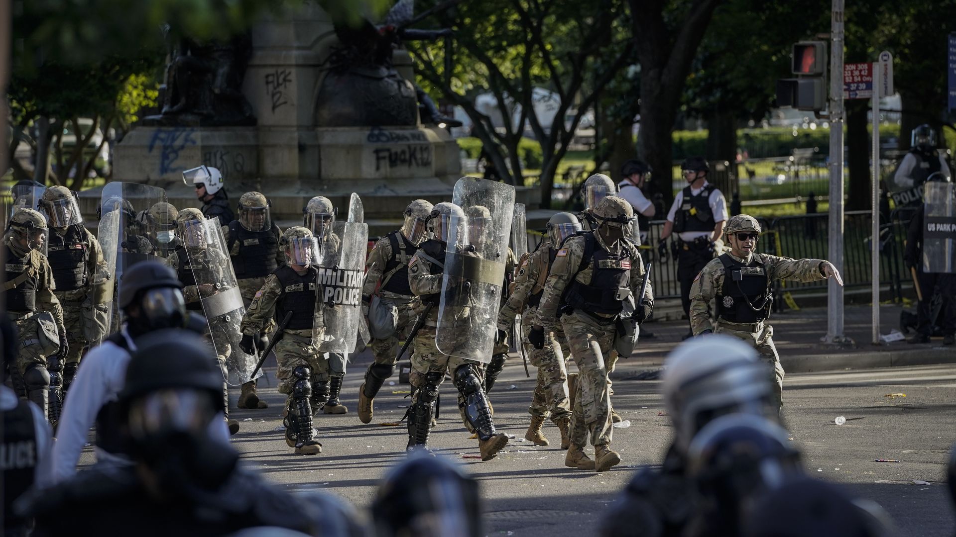 Police run towards protesters