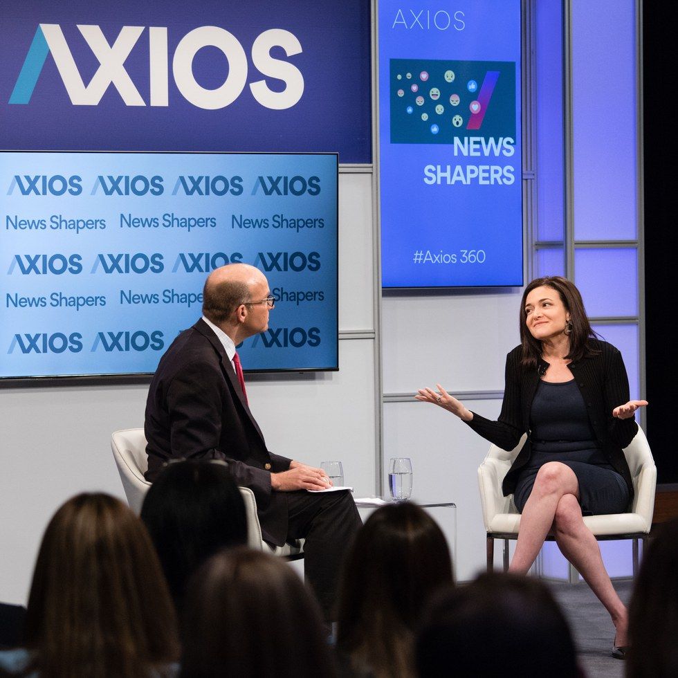 Sheryl Sandberg shrugs while speaking