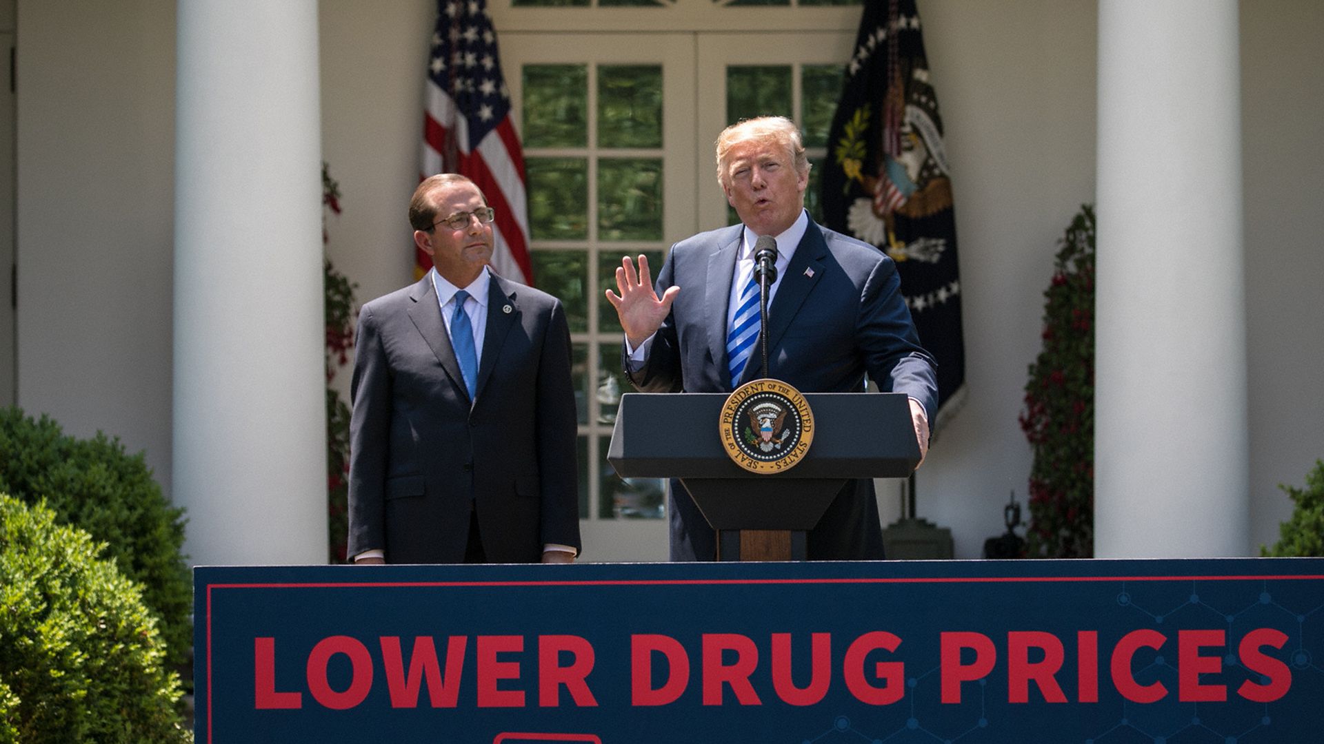 HHS Secretary Alex Azar and President Trump in the Rose Garden, talking abut drug prices
