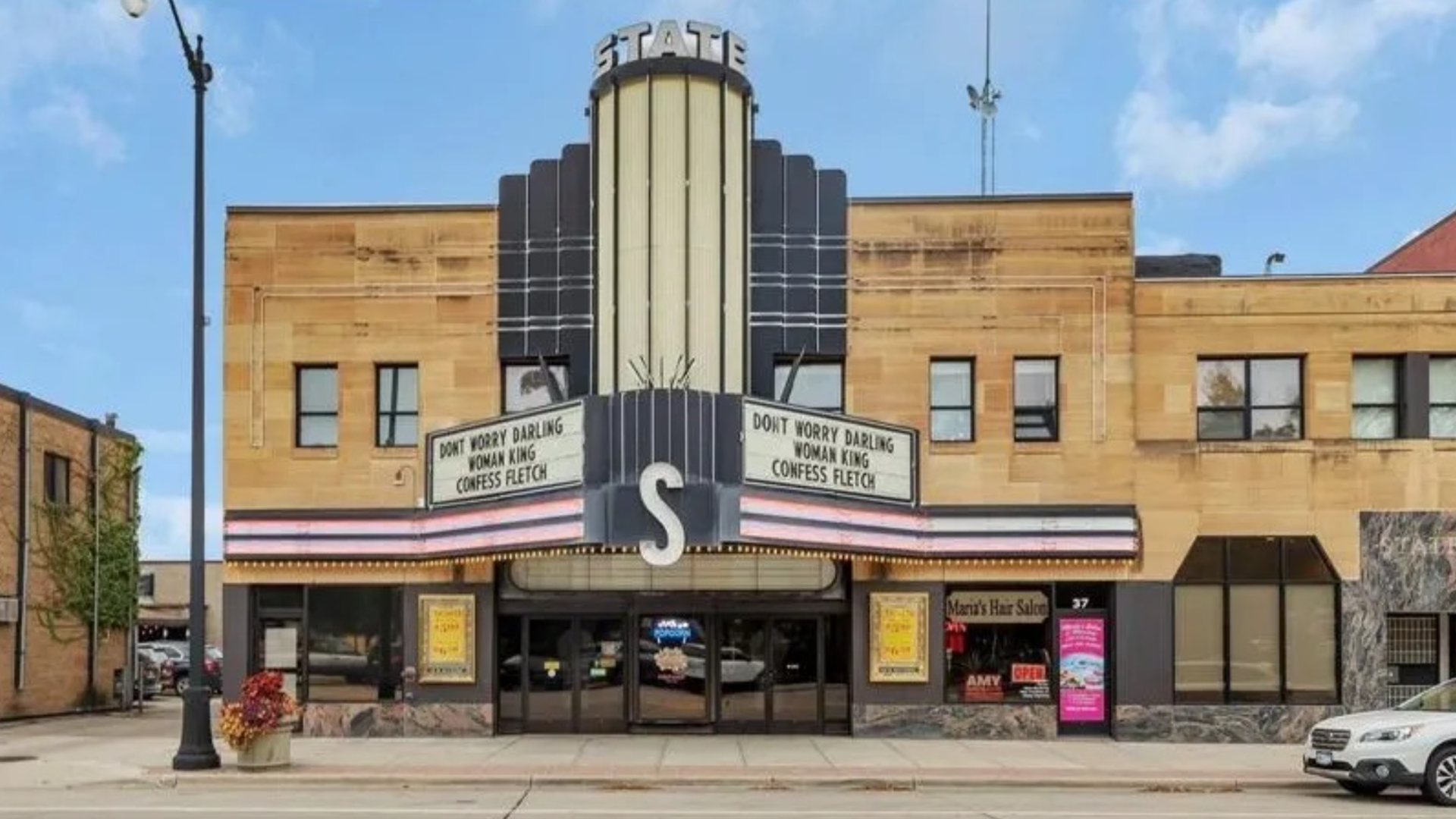 The exterior of a movie theater.