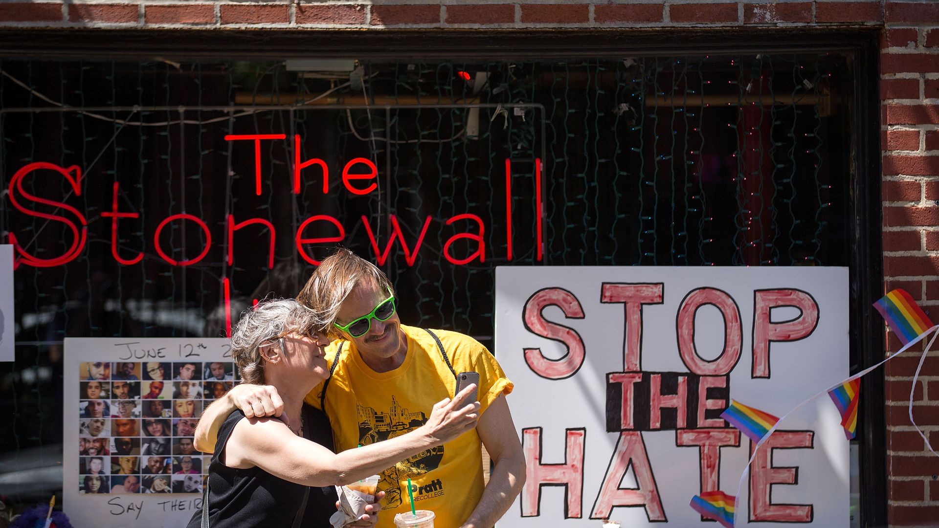 People take a selfie in front of the Stonewall Inn on June 24, 2016 in New York City. 
