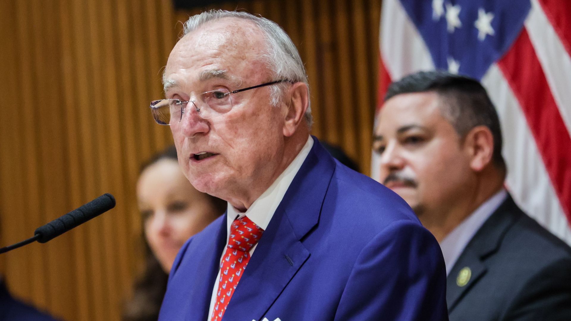 Photo shows Bill Bratton in a suit.