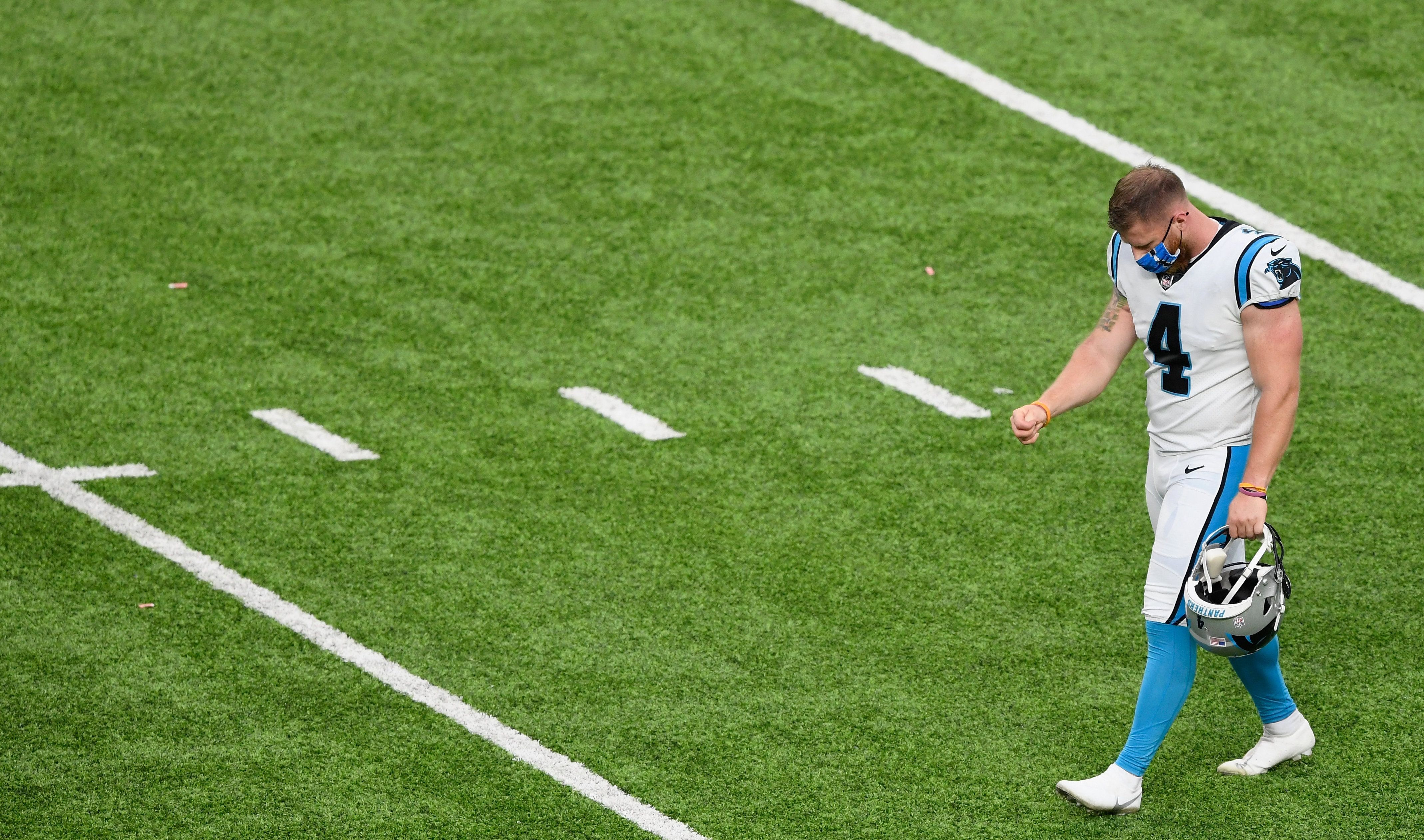 panthers kicker joey slye walking off field after missed fg